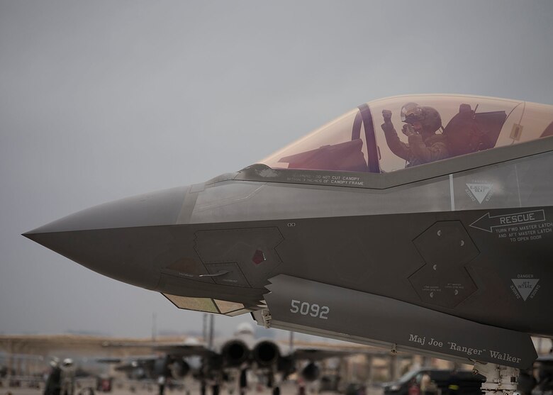 A pilot in a F-35A Lightning II fighter taxis down the ramp