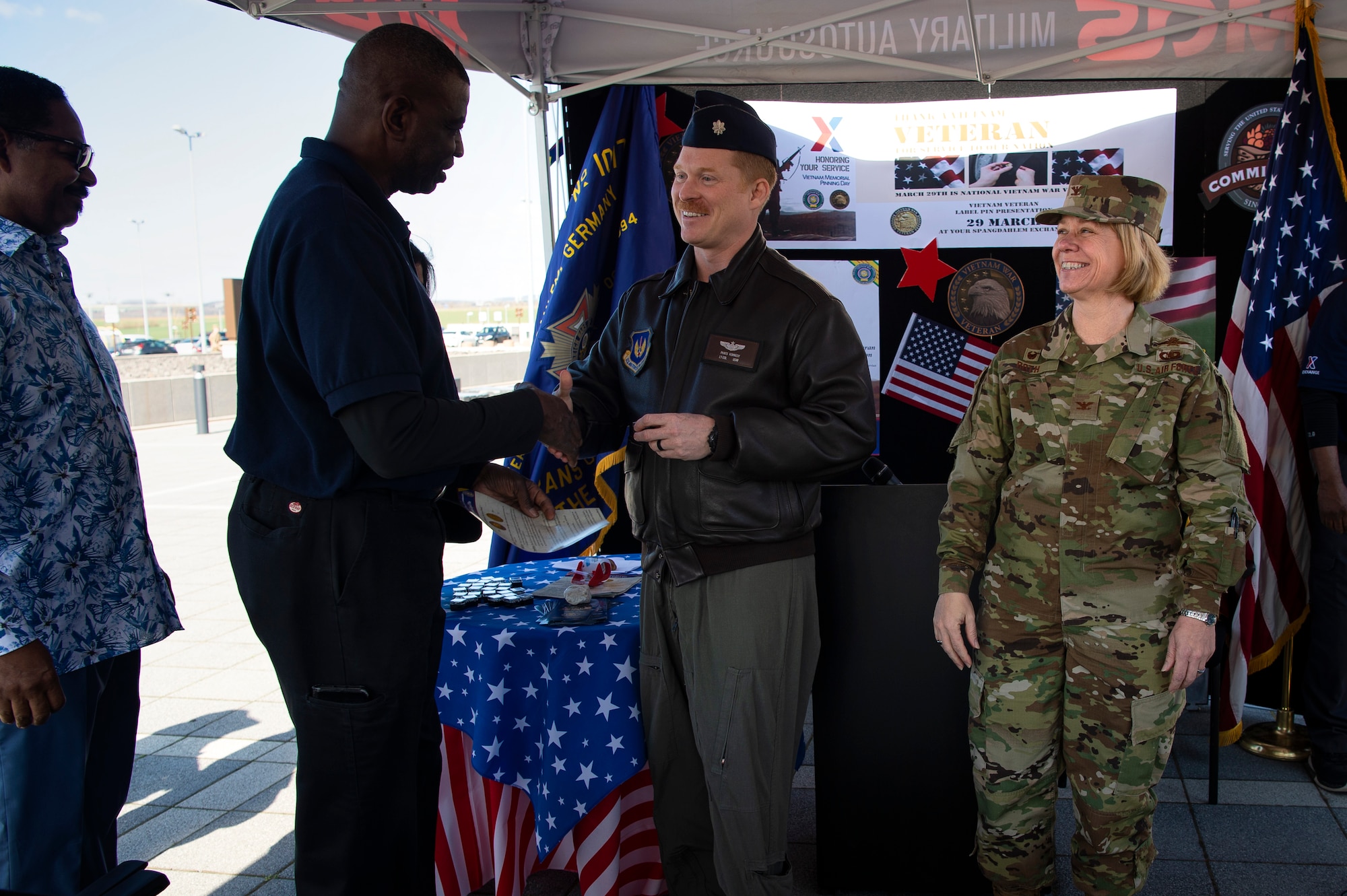 U.S. Air Force Col. Marlyce Roth, 52nd Mission Support Group commander, right, and Lt. Col. Patrick Kennedy, 52nd Fighter Wing director of staff, center, thank veterans for their service during the Vietnam War Veterans Commemoration at Spangdahlem Air Base, Germany, March 29, 2019. This day in 1973 marks the deactivation of Military Assistance Command in Vietnam. (U.S. Air Force photo by Airman 1st Class Valerie Seelye)