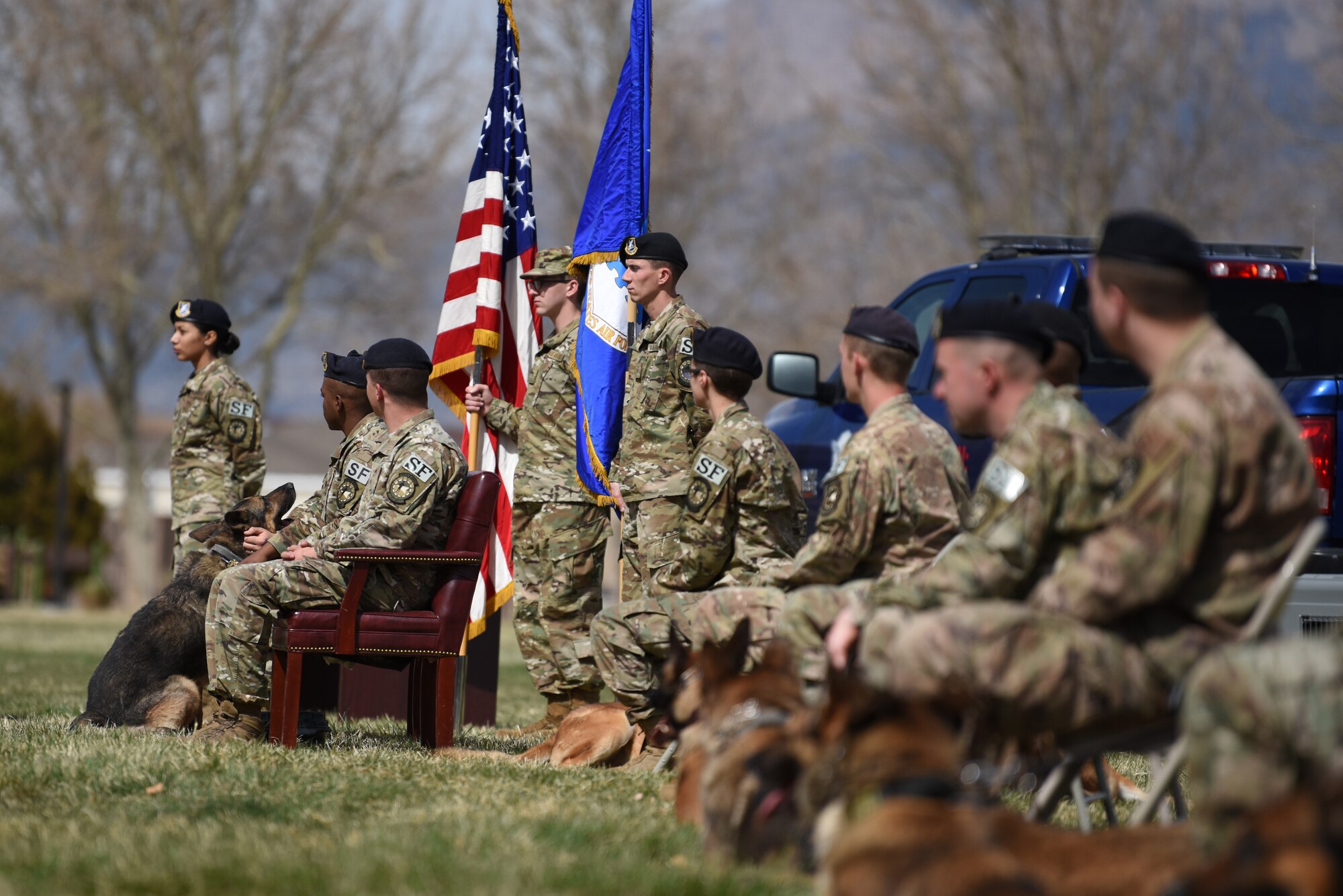 Military Working Dog Boris, far left, is retired after eight years of service at Kirtland Air Force Base, N.M., March 26, 2019. During his career, he had 85 drug finds and deployed to Afghanistan. (U.S. Air Force photo by Senior Airman Eli Chevalier)