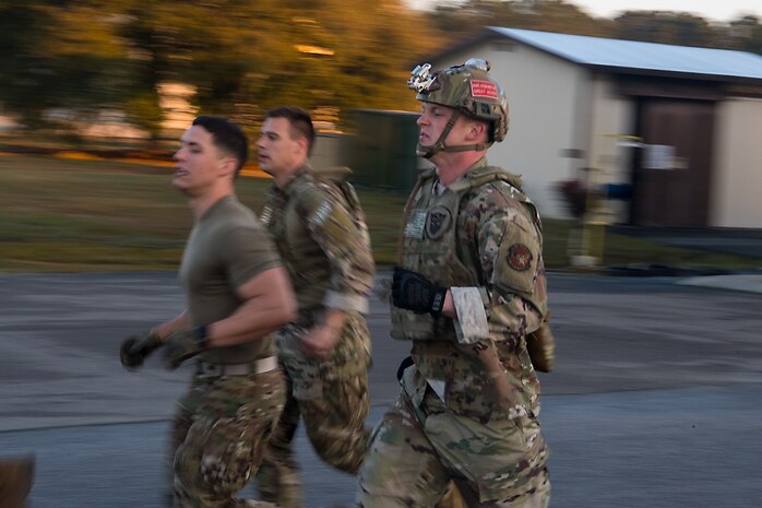 Airman 1st Class Aaron Griffith, 628th Logistics Readiness Squadron fuels distribution operator, runs to a checkpoint during a forward area refueling point team tryout March 26, 2019, at Joint Base Charleston, S.C.