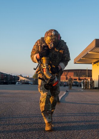 Airman 1st Class Aaron Griffith, 628th Logistics Readiness Squadron fuels distribution operator, carries a fuel hose during a forward area refueling point team tryout March 26, 2019, at Joint Base Charleston, S.C.