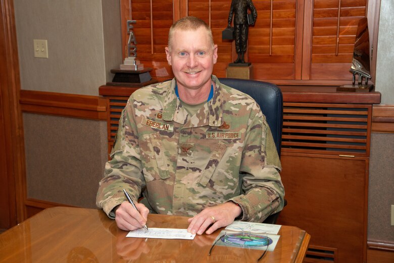 Col. Jon Eberlan, 75th Air Base Wing commander, pledges a donation to the Air Force Assistance Fund March 29, 2019, at Hill Air Force Base, Utah. The AFAF campaign began March 19 and runs through April 26. The goal for Hill AFB this year is to raise $63,361 with contributions directly benefiting Airmen, their families and retirees. For more information about the AFAF, visit afassistancefund.org or call Capt. Pamela Lampert, 801-586-9807, or Senior Master Sgt. Aron Garrard, 801-777-7421. (U.S. Air Force photo by Cynthia Griggs)