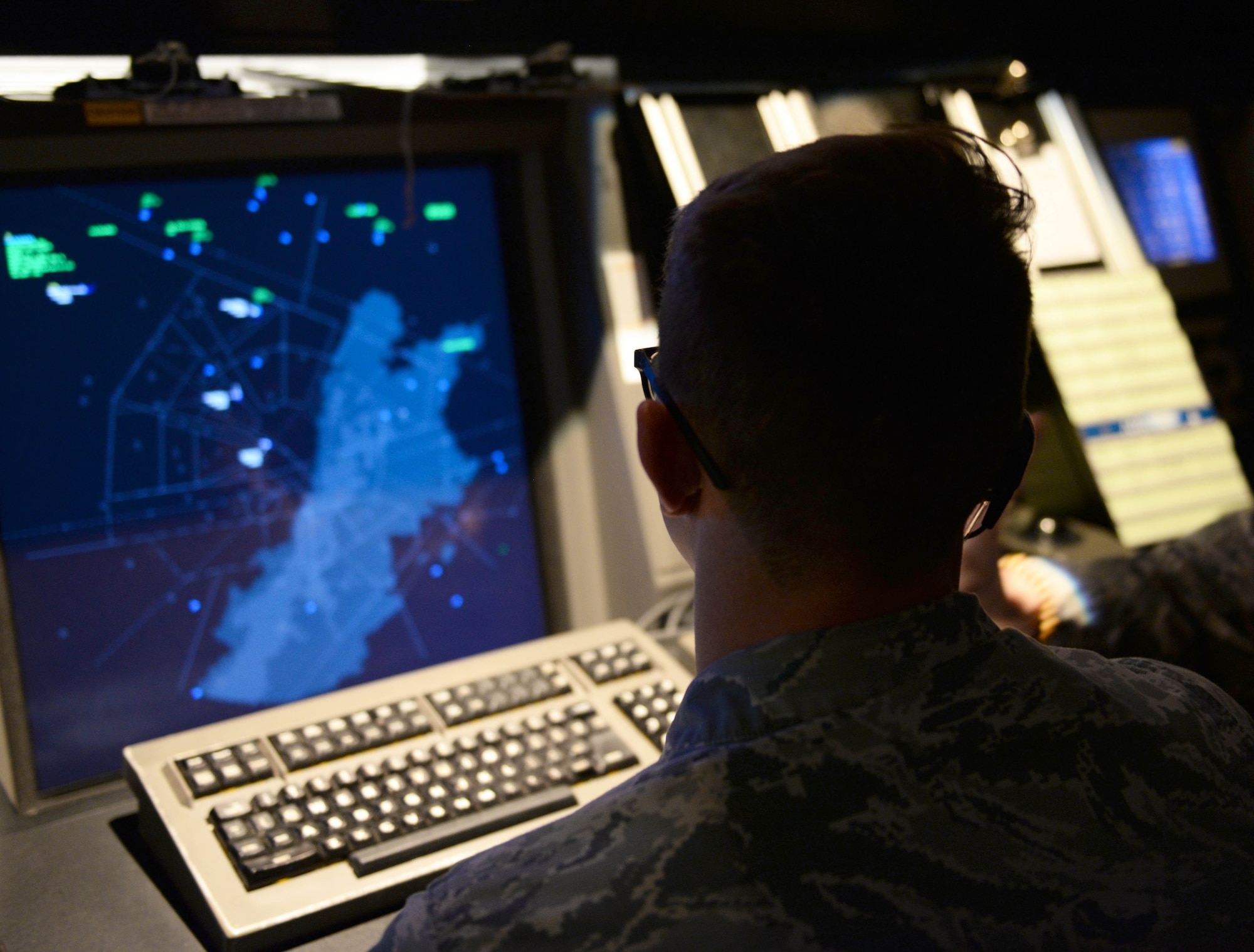 Senior Airman Dylan Fivecoate, 14th Operations Support Squadron air traffic controller looks at a radar map of the area March 25, 2019, on Columbus Air Force Base, Mississippi. Fivecoate’s heroic efforts were vital in saving the lives of two civilians involved in separate vehicle accidents, while responding as a volunteer firefighter. (U.S. Air Force photo by Airman Hannah Bean)