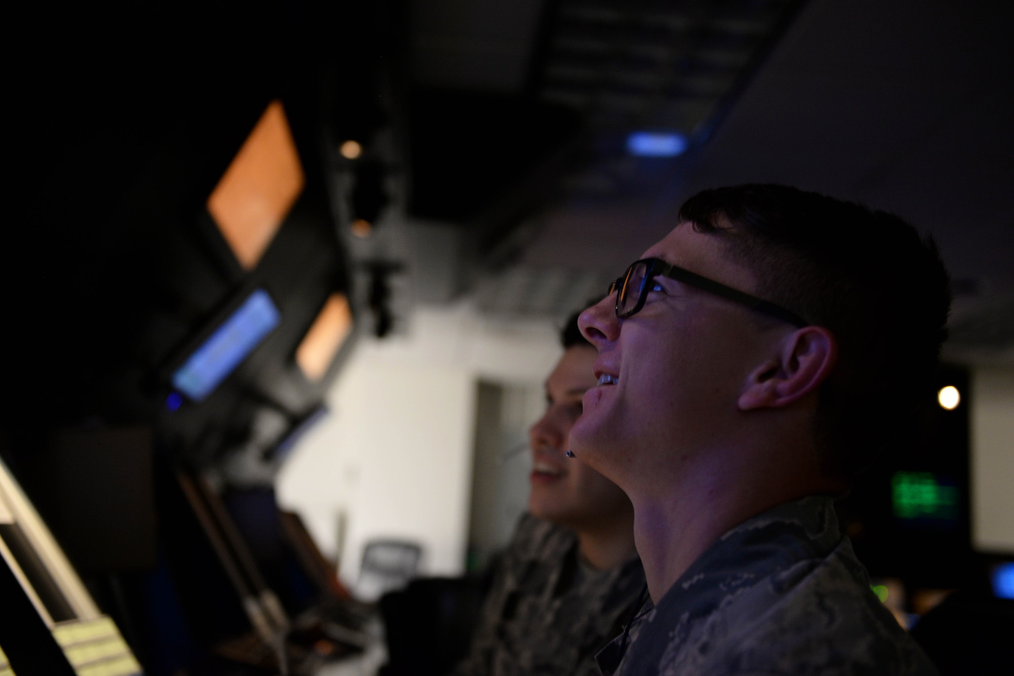 Senior Airman Dylan Fivecoate, 14th Operations Support Squadron air traffic controller, and Airman 1st Class Julian Kelhower, 14th OSS air traffic controller, look at air traffic March 25, 2019, on Columbus Air Force Base, Mississippi. In March 2019, Fivecoate was announced as the Air Education and Training Command winner for the 2019 Air Force Sergeants Association Pitsenbarger Award.  (U.S. Air Force photo by Airman Hannah Bean)