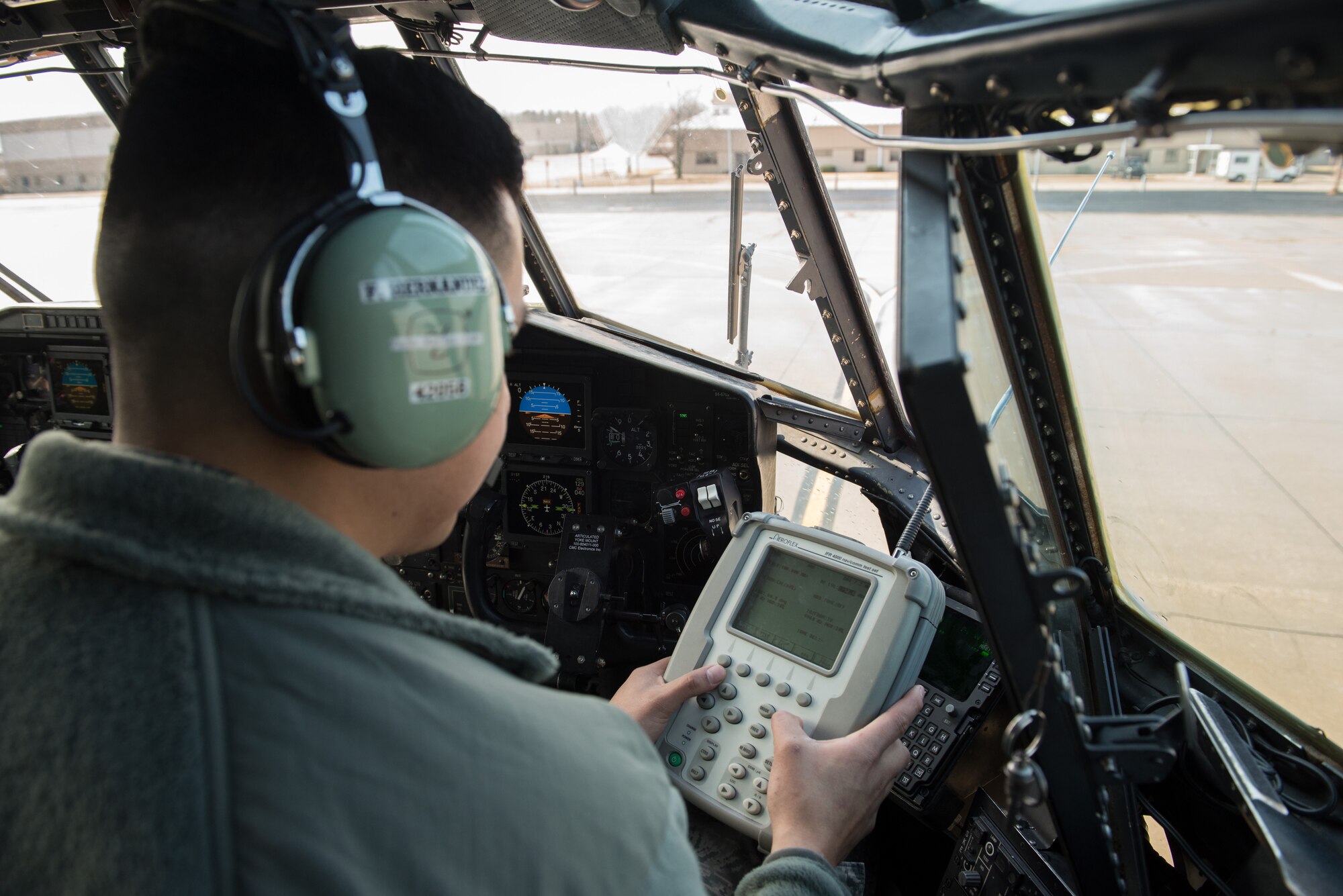 Airman inspecting aircraft.