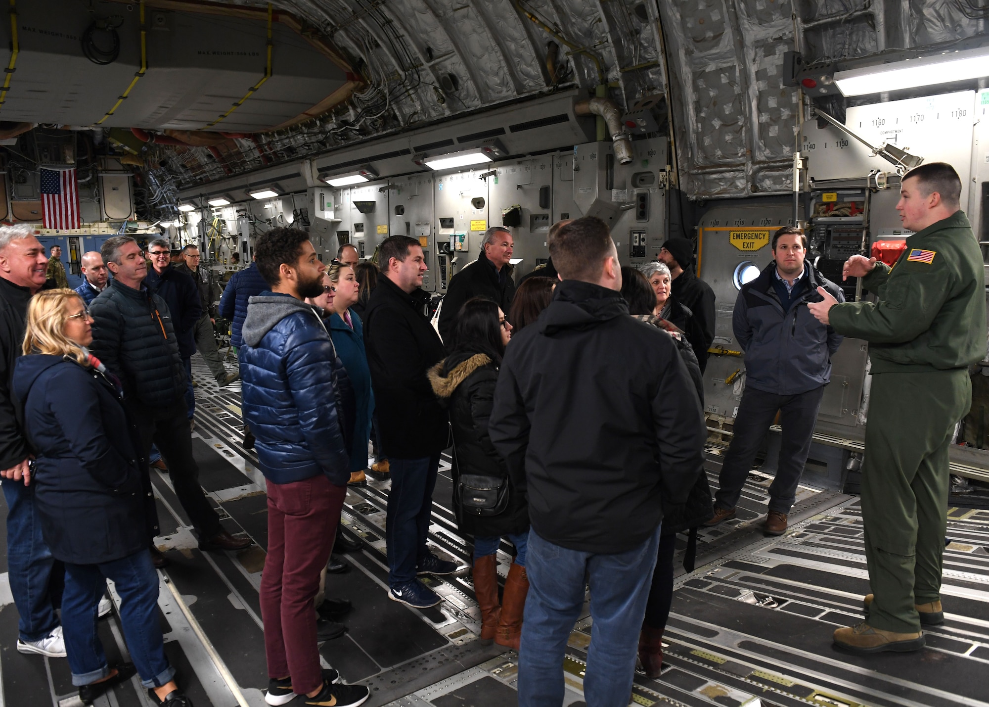 Alumni of Leadership Pittsburgh Inc. programs talk with an Airman about the U.S. Air Force Reserves during a flight on a C-17 Globemaster III aircraft near the Pittsburgh International Airport Air Reserve Station, Pennsylvania, March 22, 2019. They had the chance to speak with several Airmen while on the flight to ask questions and learn more about what the 911th Airlift Wing does for the community. (U.S. Air Force photo by Senior Airman Grace Thomson)