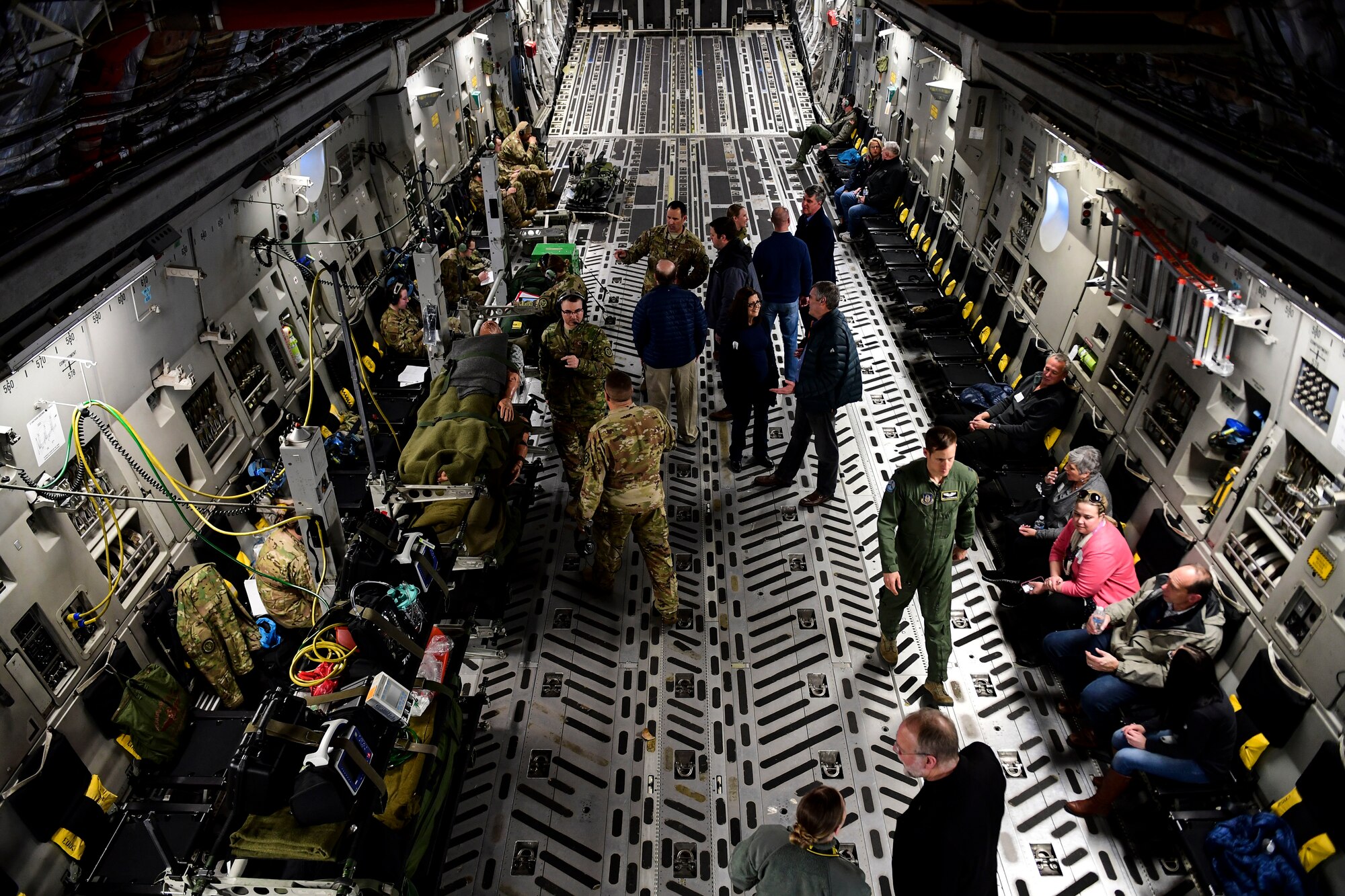 Alumni of Leadership Pittsburgh Inc. courses talk to members of the 911th Aeromedical Evacuation Squadron during a civic leader flight that was also used as a training mission for the 911th AES, near the Pittsburgh International Airport Air Reserve Station, Pennsylvania, March 22, 2019. The alumni visited the 911th Airlift Wing and learned about its functions and community impacts while also getting to fly in one of the base’s new C-17 Globemaster III aircraft. (U.S. Air Force photo by Joshua J. Seybert)