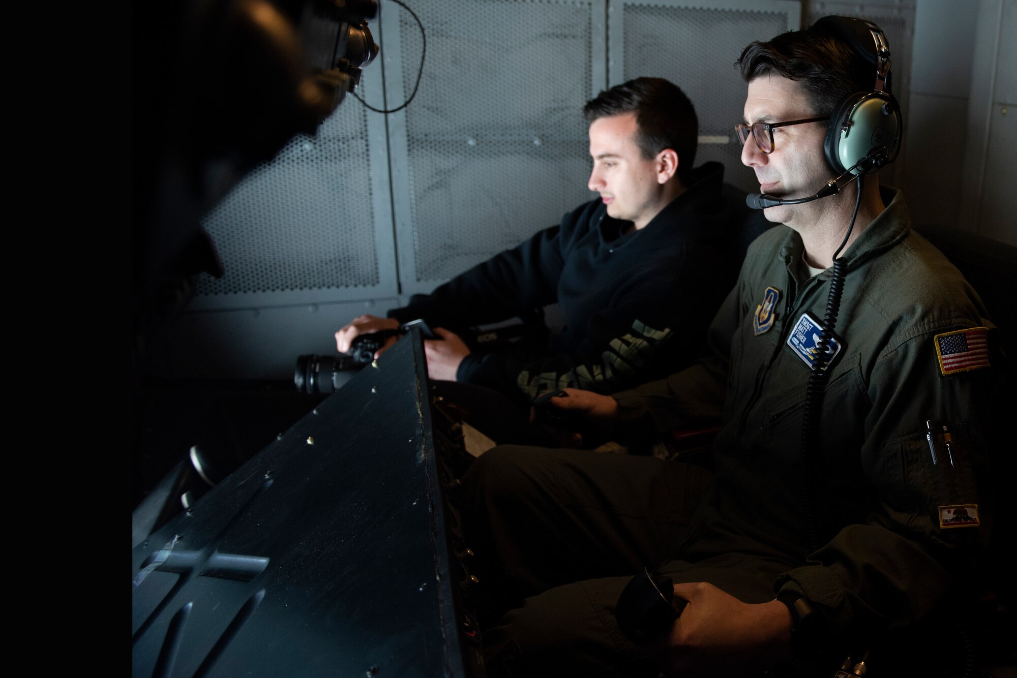 Senior Master Sgt. Matt Fisher, 70th Air Refueling Squadron boom operator, refuels a Boeing E-3 Sentry assigned to Tinker Air Force Base, Oklahoma from the back of a KC-10 Extender March 28, 2019 during a refueling mission over Northern California. The KC-10 also refueled two A-10 Thunderbolt IIs offloading more than 19,000 pounds of fuel. All three aircraft will be featured at the Thunder Over the Bay Air Show at Travis March 30-31. (U.S. Air Force photo by Tech. Sgt. James Hodgman)