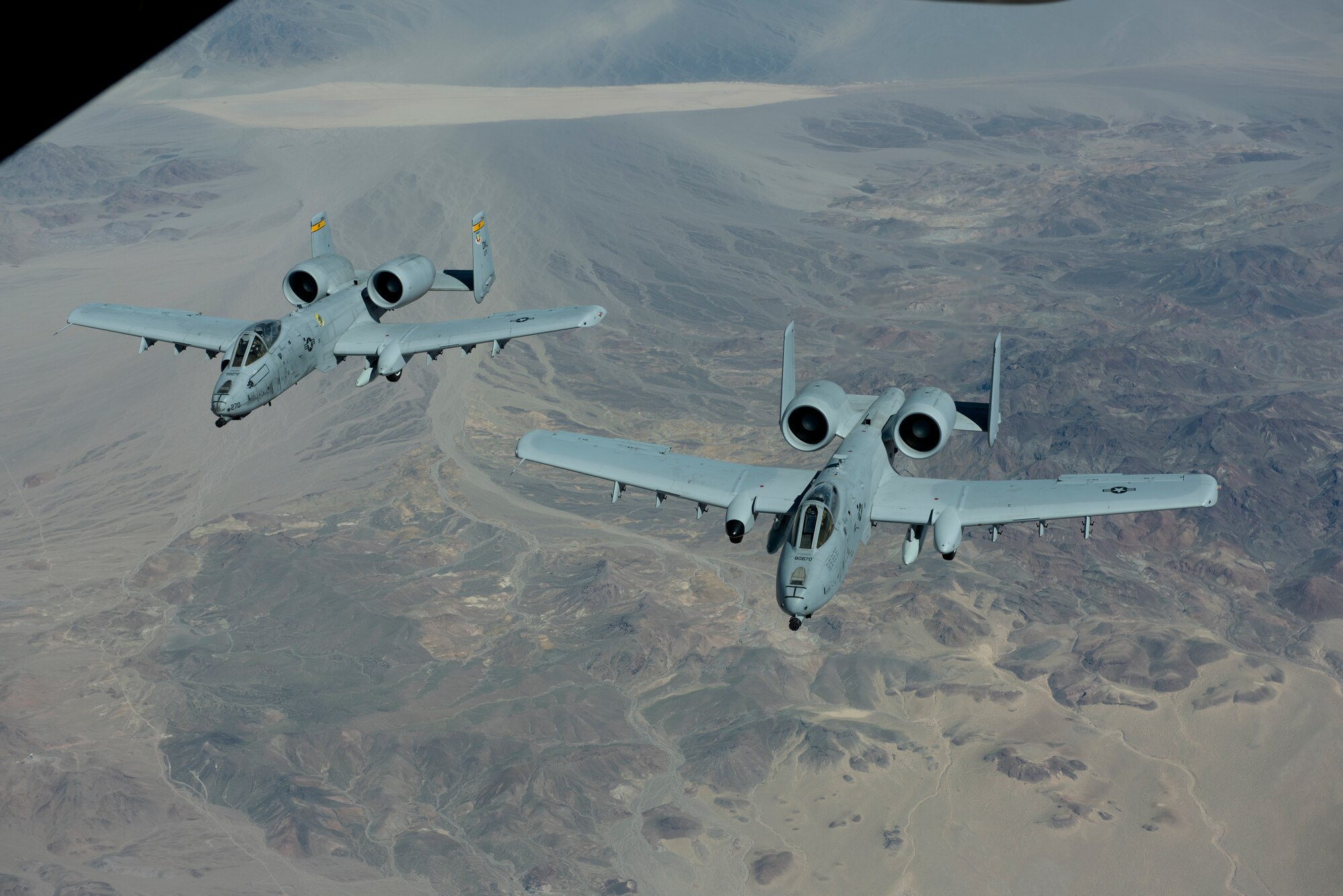 Two A-10 Thunderbolt IIs from Davis-Monthan Air Force Base, Arizona, fly over Southern California March 28, 2019 after they were refueled by a KC-10 Extender assigned to Travis Air Force Base, California. The KC-10 also refueled a Boeing E-3 Sentry, offloading more than 19,000 pounds of fuel. All three aircraft will be featured at the Thunder Over the Bay Air Show at Travis March 30-31. (U.S. Air Force photo by Tech. Sgt. James Hodgman)