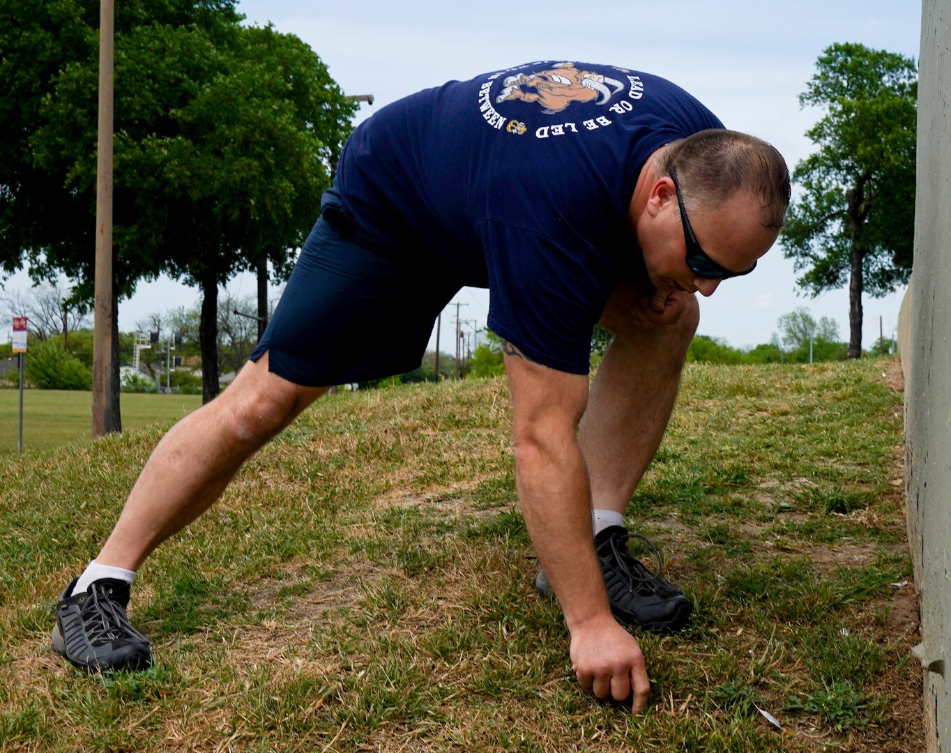 Chief Petty Officer Steven Kellystahlnecker, assigned to Navy Medicine Education, Training and Logistics Command at Joint Base San Antonio-Fort Sam Houston, picks up trash during a community relations event held at Martinez Park during a Sailor 360 event. Sailor 360 is a command-level program for junior enlisted, senior enlisted and junior officers designed to strengthen and develop leadership through COMREL events, classroom discussions and physical training events.