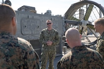 JOINT EXPEDITIONARY BASE LITTLE CREEK, VIRGINIA BEACH, Va. – U.S. Navy Chief Eric Waters, a quarter master with Detachment 1, Assault Craft Unit FOUR, speaks to Marines and Sailors with U.S. Marine Corps Forces Command during a tour of the Landing Craft, Air Cushion March 29, 2019, aboard Joint Expeditionary Base Little Creek in Virginia Beach, Virginia.