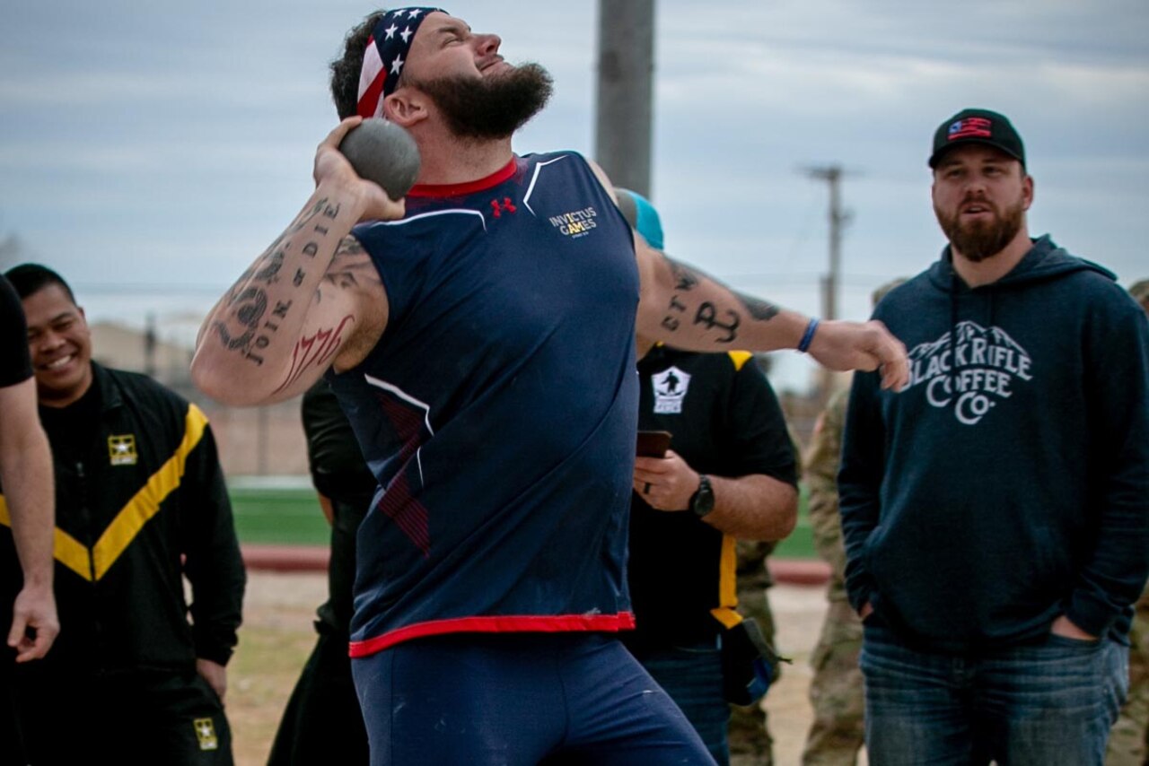 Man throws the shot put.