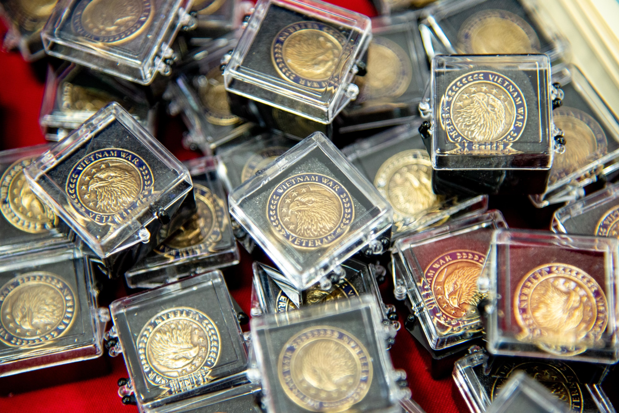 A stack of Vietnam Veteran lapel pins during the Vietnam Veteran Pinning, March 29, 2019, at the Main Exchange at Hill Air Force Base, Utah. Base Exchanges around the world hosted pinning ceremonies to honor Vietnam veterans on Vietnam Veterans Day. Vietnam Veterans Day is celebrated every March 29 to honor the courage and sacrifice of those who served in the Vietnam War. (U.S. Air Force photo by Cynthia Griggs)