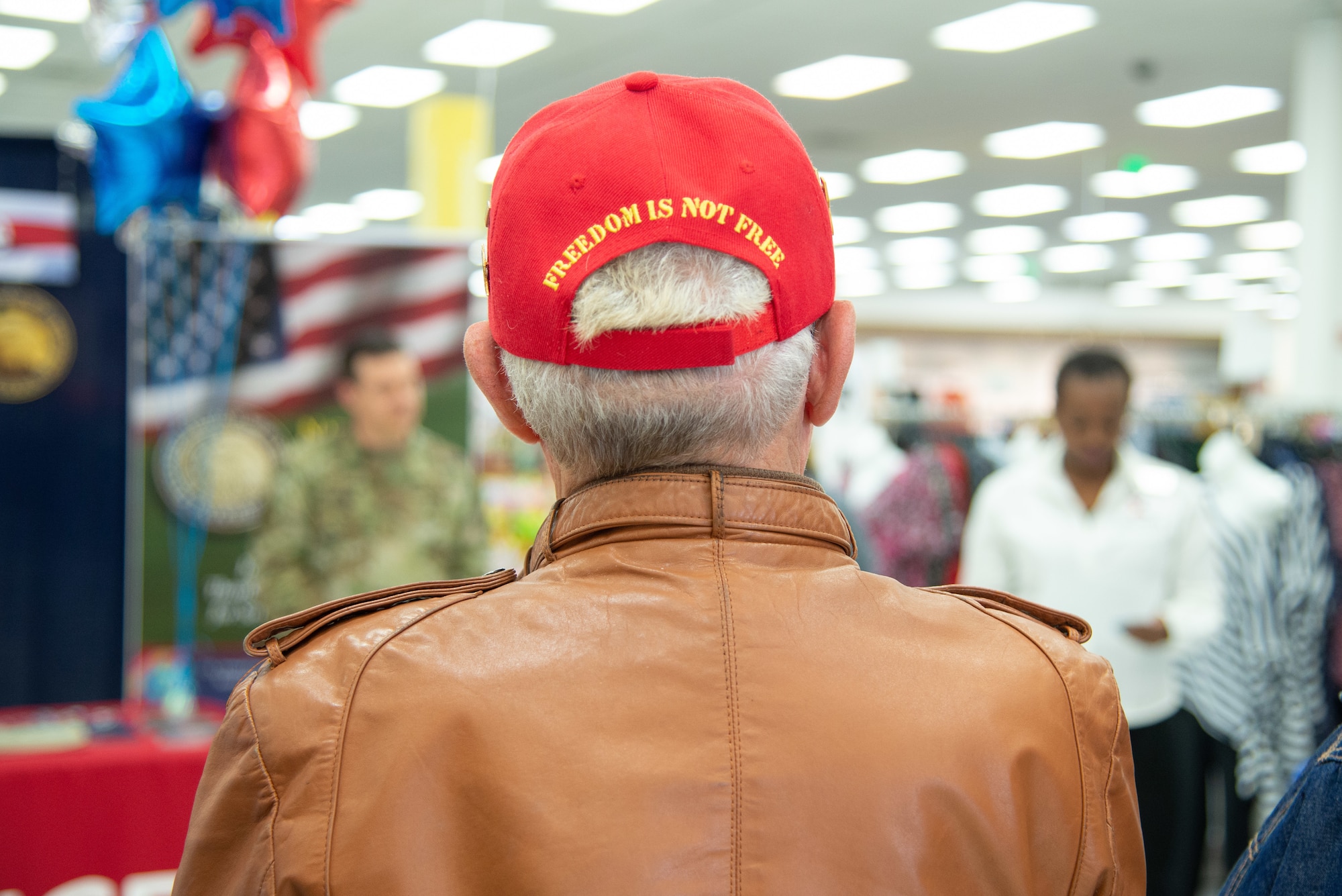 United States Navy veteran Bill Kelley stands by as President Donald Trump's proclamation is read commemorating the anniversary of the ending of the Vietnam War during the Vietnam Veteran Pinning, March 29, 2019, at the Main Exchange at Hill Air Force Base, Utah. Base Exchanges around the world hosted pinning ceremonies to honor Vietnam Veterans on Vietnam Veterans Day. Vietnam Veterans Day is celebrated every March 29 to honor the courage and sacrifice of those who served in the Vietnam War. (U.S. Air Force photo by Cynthia Griggs)