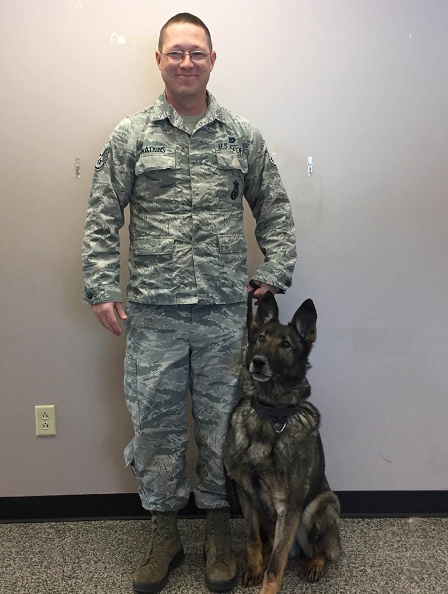 Staff Sgt. Matthew Watkins, a handler in the 88th Security Forces Squadron at Wright-Patterson Air Force Base for five years, has worked with 11 dogs. His current dog is MWD Casey, an 8-year-old male German shepherd. (Skywrighter photo/Amy Rollins)
