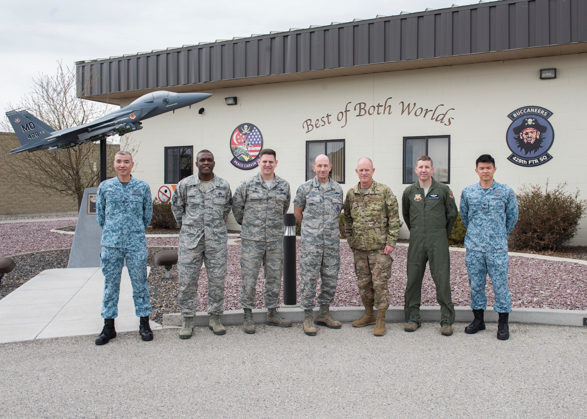 U.S. Air Force Gen. Mike Holmes, commander of Air Combat Command, and Chief Master Sgt. Frank Batten, ACC command chief, take a group photo with leadership from the 428th Fighter Squadron, March 27, 2019, at Mountain Home Air Force Base, Idaho. The 428th Fighter Squadron are members from Peace Carvin V of the Republic of Singapore Air Force. (U.S. Air Force photo by Senior Airman Tyrell Hall)