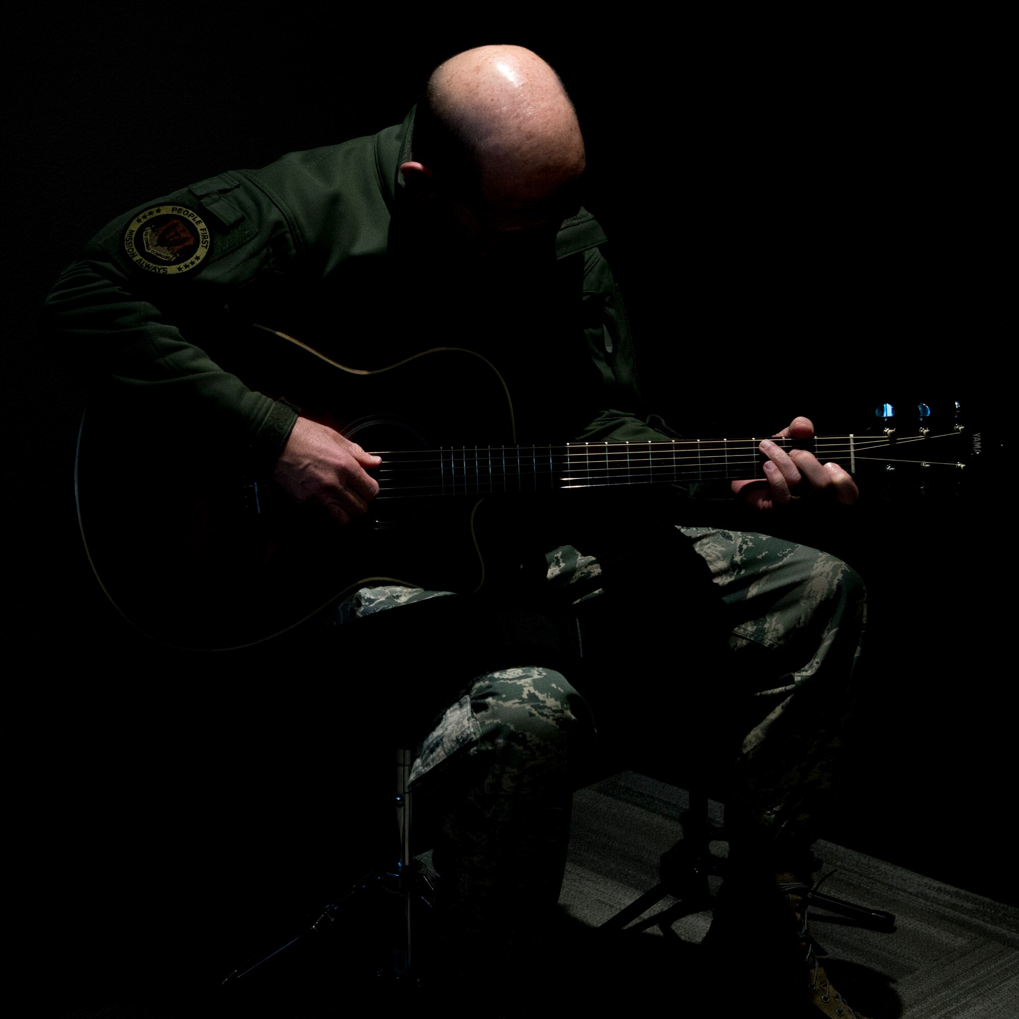 U.S. Air Force Gen. Mike Holmes, commander of Air Combat Command, plays a guitar at the Airmen's Center, March 27, 2019, at Mountain Home Air Force Base, Idaho. Holmes visited the Airmen’s Center to discuss the morale and welfare of Airmen on base. (U.S. Air Force photo by Airman 1st Class JaNae Capuno)
