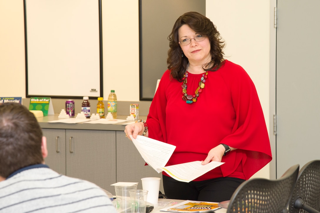 Mary Bouldin, a nurse educator from the Redstone Arsenal Center for Comprehensive Wellness, talks with Huntsville Center employees on the topic of nutrition in Huntsville, Alabama, March 29, 2019.