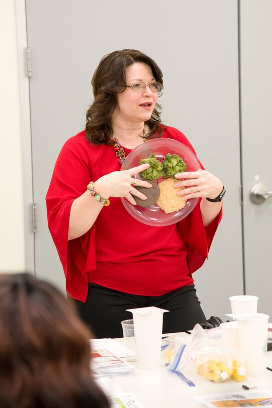 Mary Bouldin, a nurse educator from the Redstone Arsenal Center for Comprehensive Wellness, talks with Huntsville Center employees on the topic of nutrition in Huntsville, Alabama, March 29, 2019.