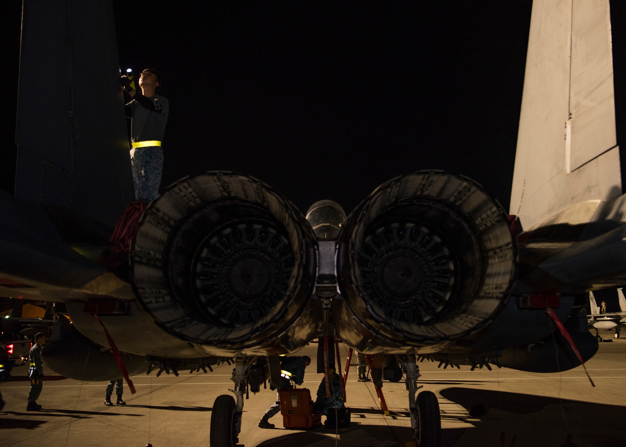 Airmen from the 428th Fighter Squadron inspect an F-15SG Strike Eagle post-flight March 18, 2019, at the Red Flag exercise on Nellis Air Force Base, Nevada. Red flag is the world’s premiere air-to-air combat training exercise. (U.S. Photo by Airman First Class Andrew Kobialka)