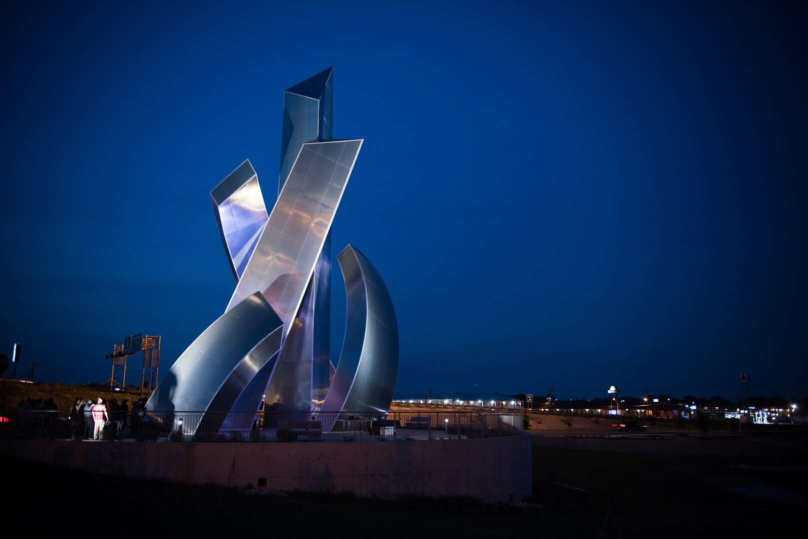 Members of Joint Base San Antonio-Lackland and local community officials gather for the Tribute to Freedom sculpture grand opening, Mar. 27, 2019, at the corner of U.S. Highway 90 and Military Drive.