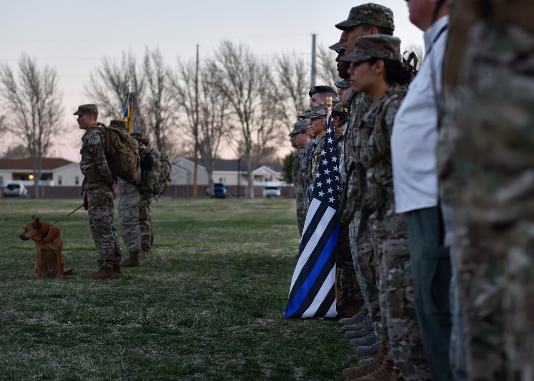 Participants of the 2019 377th Security Forces Squadron Suicide Awareness Ruck March stand in formation at Kirtland Air Force Base, N.M., March 29, 2019. The ruck march was created to support The Brave Badge Initiative Facebook page. The Facebook page was created due to the increased rates in suicide in the security forces career field in the past year and aims to give Defenders another place to go to when they are struggling with mental health issues. (U.S. Air Force photo by Airman 1st Class Austin J. Prisbrey)