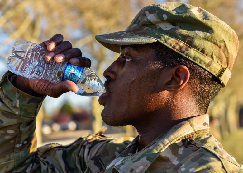 U.S. Air Force Airman 1st Class Yaukis Cole, 377th Weapons System Security Squadron, drinks water at Kirtland Air Force Base, N.M., March 29, 2019. Cole finished the three mile ruck second with a time of approximately 24 minutes. (U.S. Air Force photo by Airman 1st Class Austin J. Prisbrey)