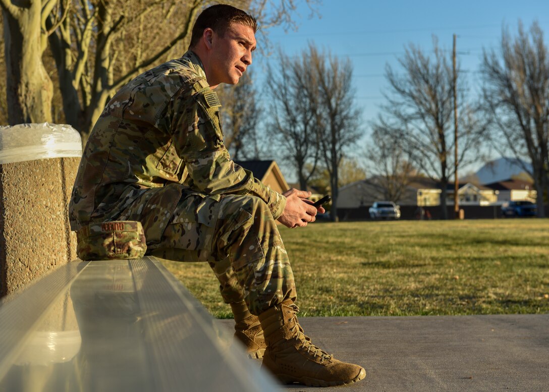 U.S. Air Force Senior Airman Scott Queen, 377th Security Forces Squadron unit fitness program manager, rests at Kirtland Air Force Base, N.M., March 29, 2019. Queen finished the three mile ruck first with a time of approximately 23 minutes. (U.S. Air Force photo by Airman 1st Class Austin J. Prisbrey)