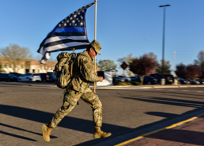 U.S. Air Force Senior Airman Tatyana Howard, 377th Security Forces Squadron Alpha Flight line monitor, rucks at Kirtland Air Force Base, N.M., March 29, 2019. The ruck march was created to support The Brave Badge Initiative Facebook page. The Facebook page was created due to the increased rates in suicide in the security forces career field in the past year and aims to give Defenders another place to go to when they are struggling with mental health issues. (U.S. Air Force photo by Airman 1st Class Austin J. Prisbrey)