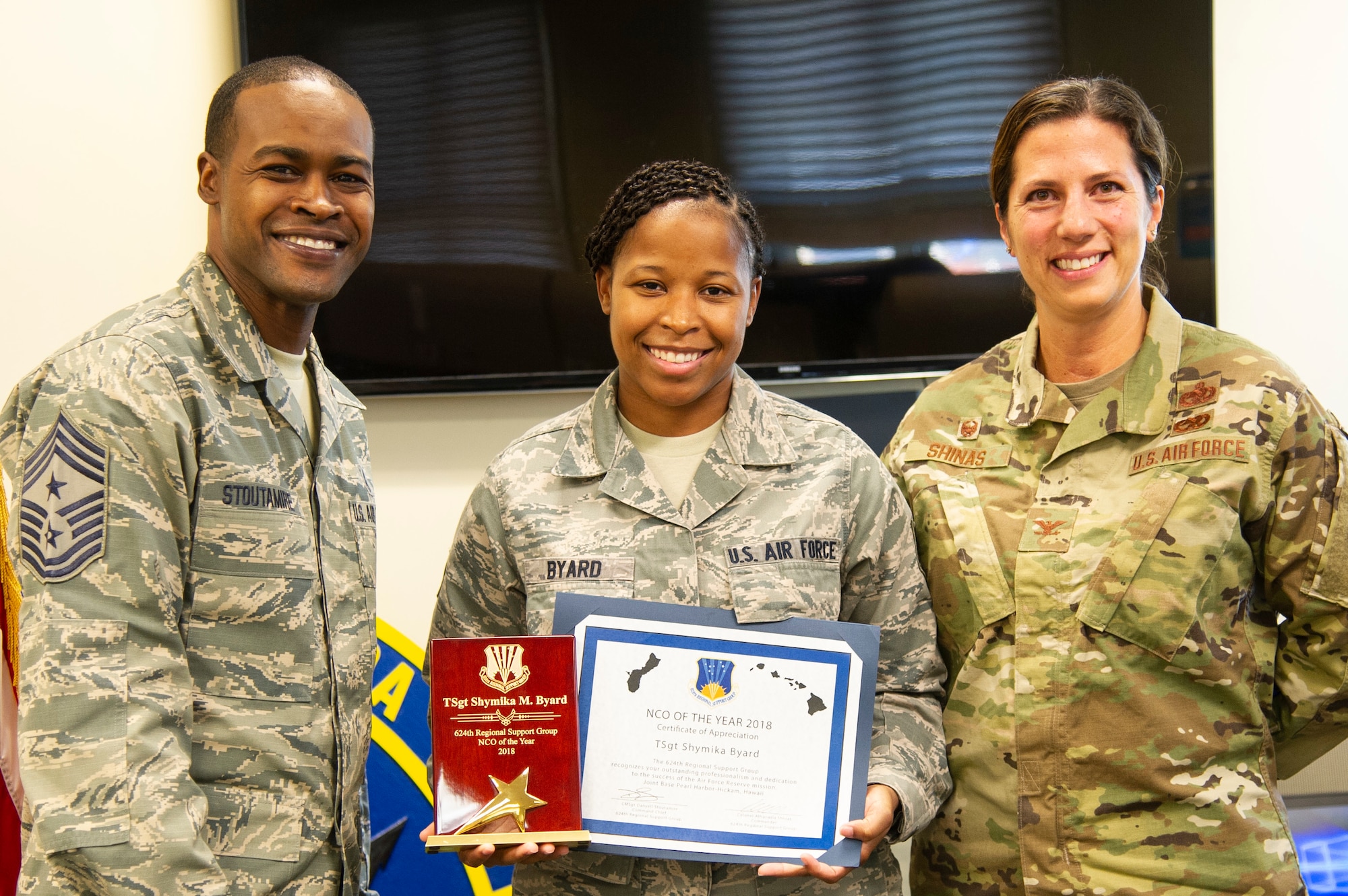 ech. Sgt. Shymika Byard, a Reserve Citizen Airmen from the 624th Regional Support Group, receives the Group’s 2018 Noncommissioned Officer of the Year award from Col. Athanasia Shinas, 624th RSG commander, and Chief Master Sgt. Danyell Stoutamire, 624th RSG command chief, during an awards presentation March 3, 2019, at Joint Base Pearl Harbor-Hickam, Hawaii.