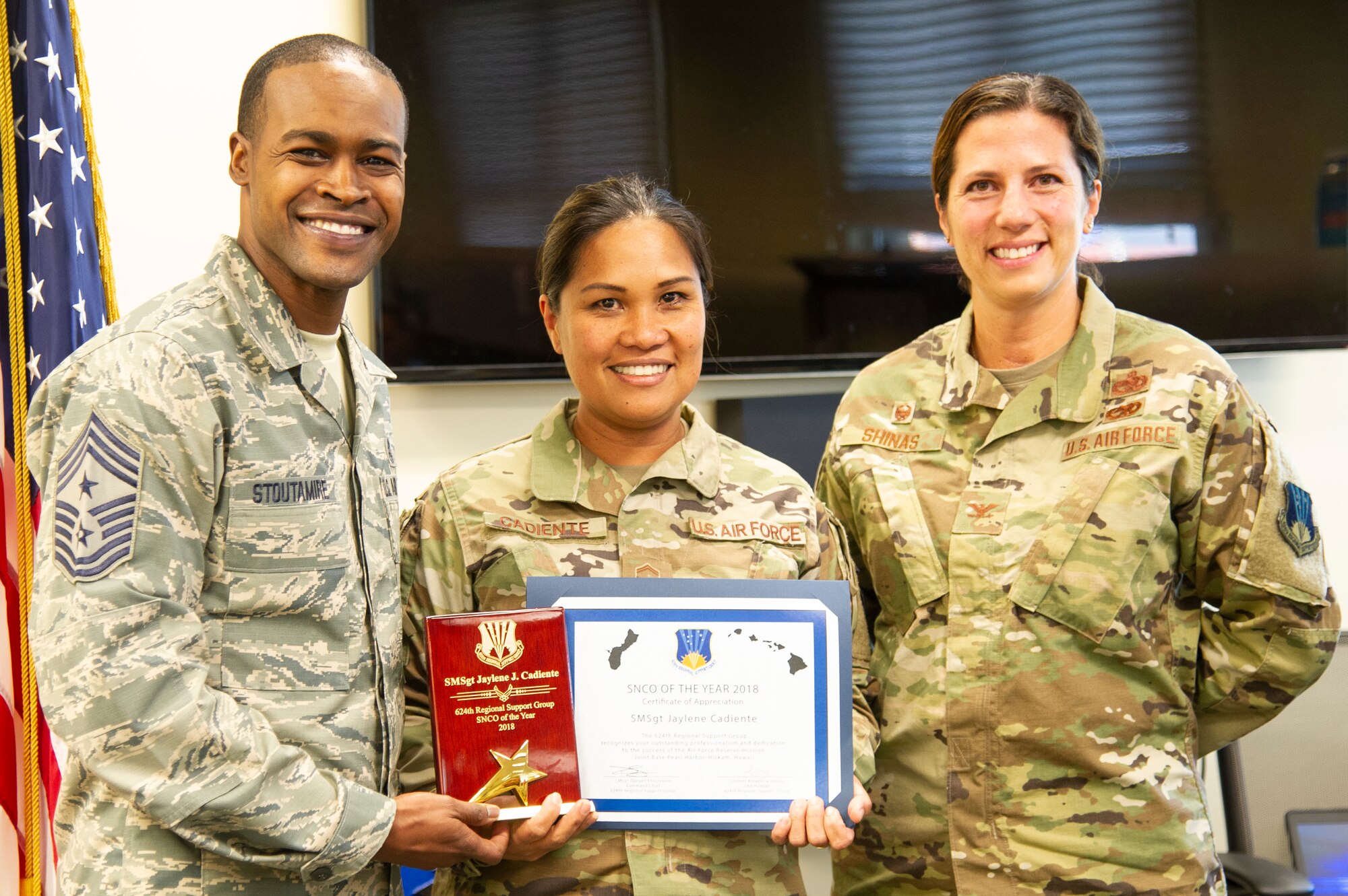 Senior Master Sgt. Jaylene Cadiente, a Reserve Citizen Airmen from the 624th Regional Support Group, receives the Group’s 2018 Senior Noncommissioned Officer of the Year award from Col. Athanasia Shinas, 624th RSG commander, and Chief Master Sgt. Danyell Stoutamire, 624th RSG command chief, during an awards presentation March 3, 2019, at Joint Base Pearl Harbor-Hickam, Hawaii.
