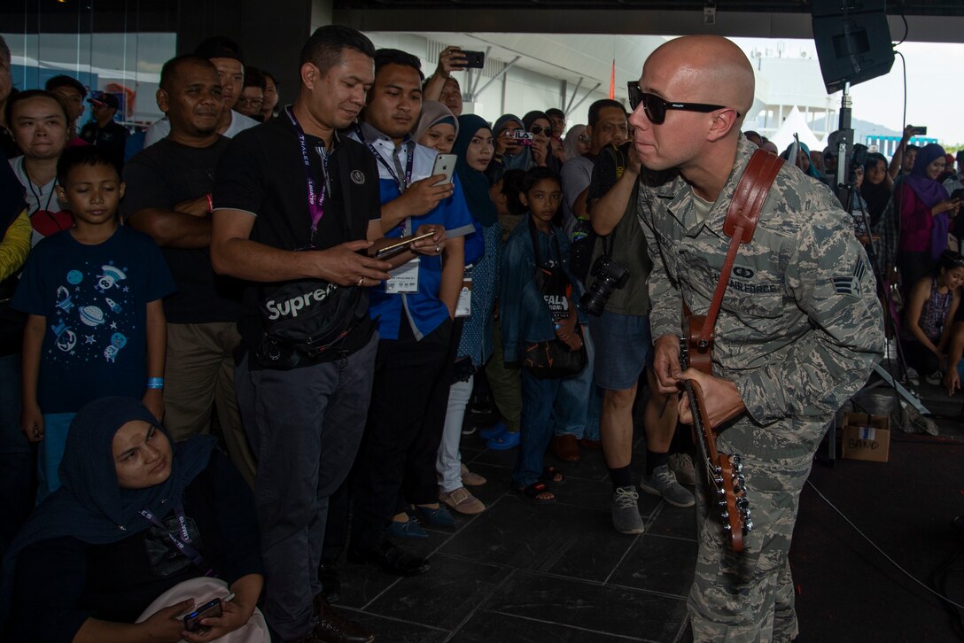 Members of the U.S. Air Force Band of the Pacific entertain audiences at the Langkawi International Maritime and Aerospace Exhibition 2019 in Padang Mat Sirat, Malaysia, March 29, 2019.