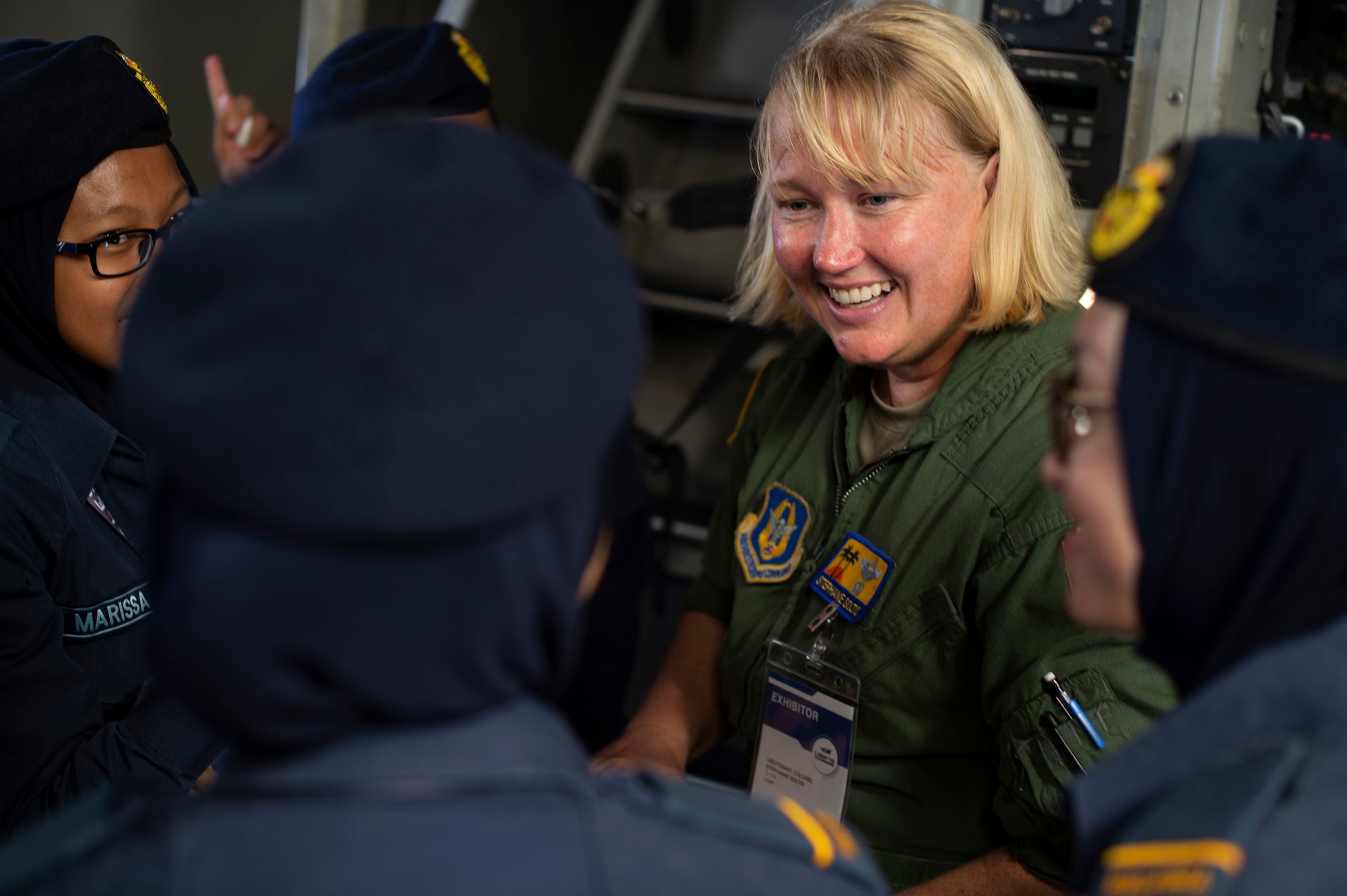 Lt. Col. Stephanie Soltis, 452nd Air Mobility Wing C-17 Globemaster III pilot from March Air Force Base, Calif., speaks to members of the Malaysian Defence Force during the Langkawi International Maritime and Aerospace Exhibition 2019 in Padang Mat Sirat, Malaysia, March 29, 2019.