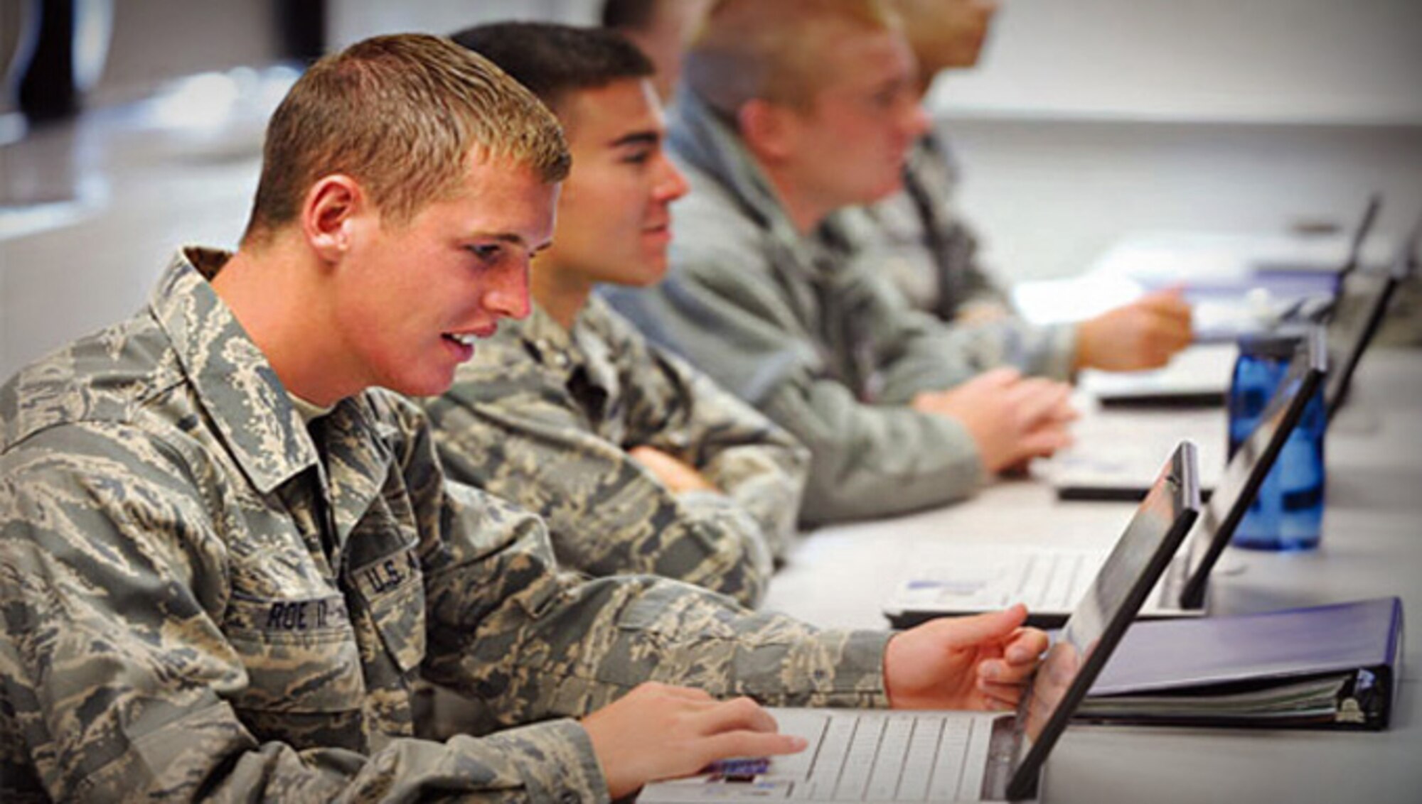 Airmen study using Air Force Network-powered laptops, made possible by the Program Executive Office for Command, Control, Communications, Intelligence and Networks at Hanscom Air Force Base, Mass. (U.S. Air Force stock photo)