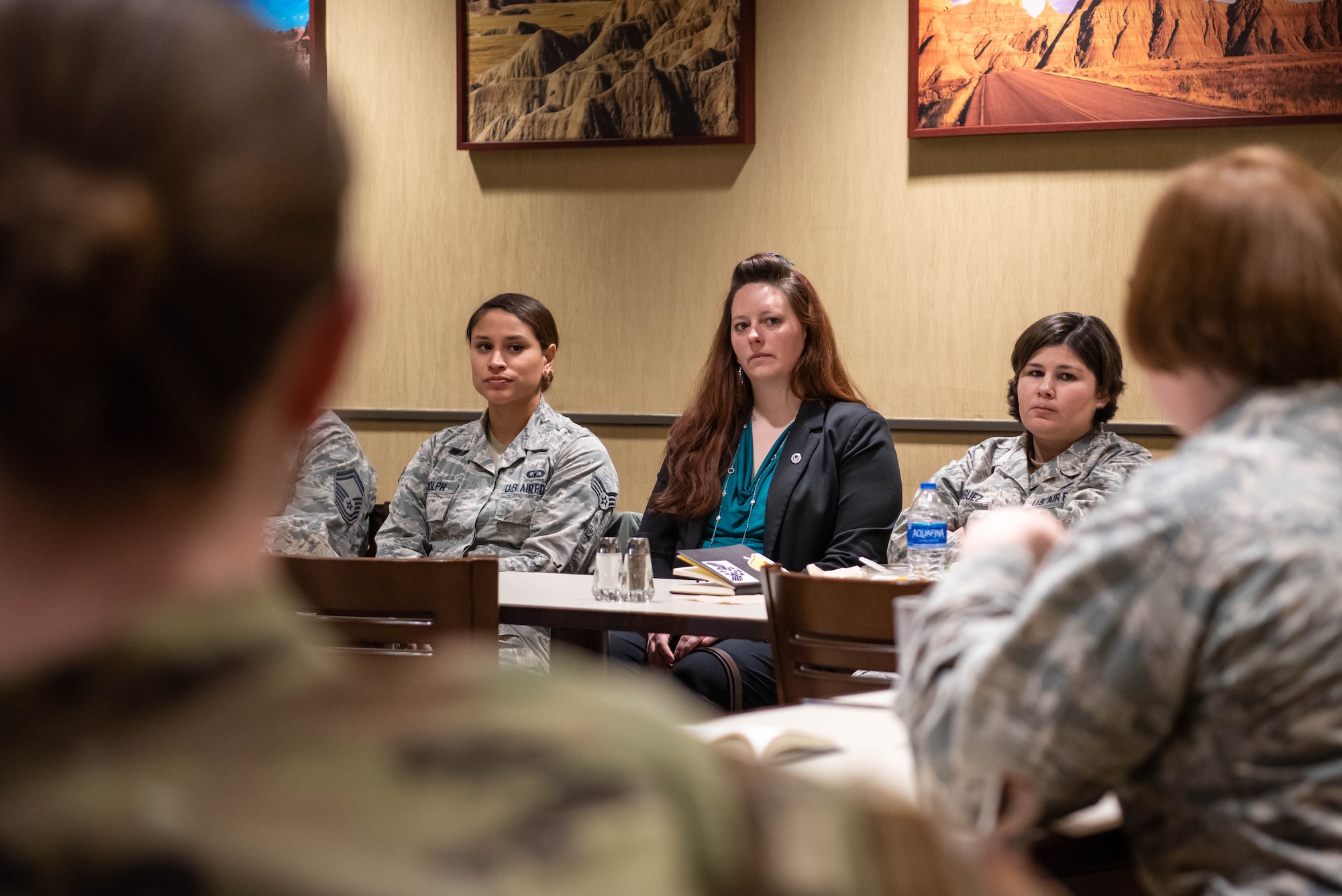 Base members speak at the 28th Bomb Wing Women’s Lean In Circle in the Raider Café conference room on Ellsworth Air Force Base, S.D., March 26, 2019. Both men and women serving on Ellsworth AFB were invited to attend to discuss and break down barriers to success and happiness that are based on gender. Col. Sarah Deaver, the 28th Mission Support Group commander, was the keynote speaker for the event. (U.S. Air Force photo by Tech. Sgt. Jette Carr)