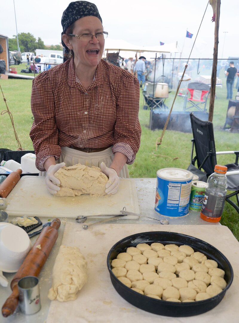 Linda Williams, from the Maxdale Cowboy Church chuck wagon out of Killeen, Texas, prepares biscuits for the annual Cowboys for Heroes chuckwagon event at Joint Base San Antonio-Fort Sam Houston March 30.