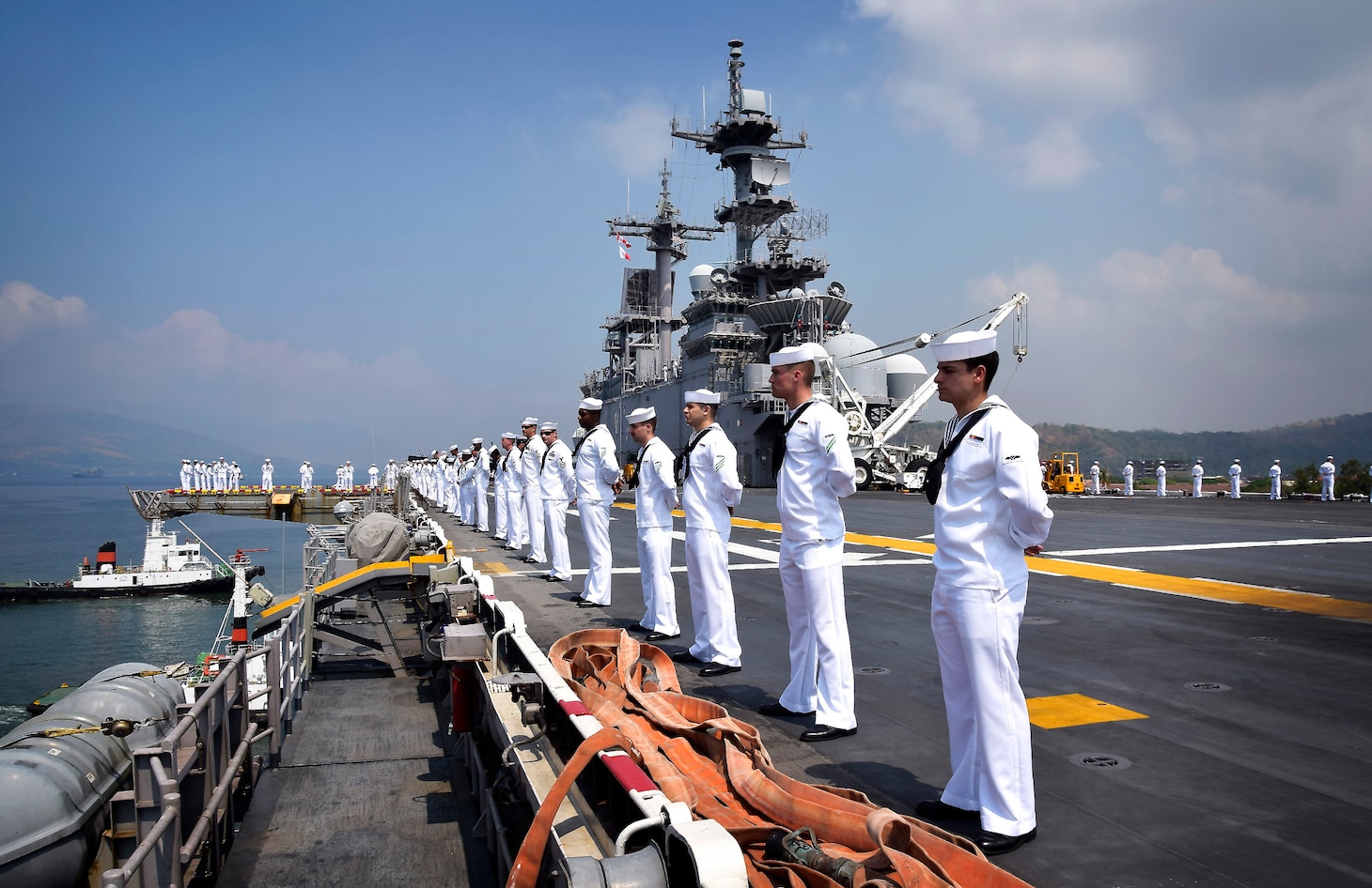 SUBIC BAY, Philippines (March 30, 2019) Sailors man the rails aboard the amphibious assault ship USS Wasp (LHD 1) as the ship arrives in Subic Bay, Philippines in support of Exercise Balikatan. Exercise Balikatan, in its 35th iteration, is an annual U.S., Philippine military training exercise focused on a variety of missions, including humanitarian assistance and disaster relief, counter-terrorism, and other combined military operations.