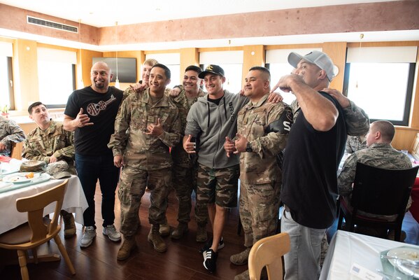 Entertainers and athletes have lunch with service members before a USO show at Ramstein Air Base, Germany, the first stop on the annual Vice Chairman’s USO Tour, March 30, 2019. Country music artist Craig Morgan, celebrity chef Robert Irvine, UFC Hall of Famer BJ Penn, former UFC Middleweight champion Chris Weidman, professional mixed martal artist Felice Herrig, two-time MLB World Series champion Shane Victorino; and professional surfer Makua Rothman will join Air Force Gen. Paul J. Selva, vice chairman of the Joint Chiefs of Staff, on a tour across the world as they visit service members overseas to thank them for their service and sacrifice.