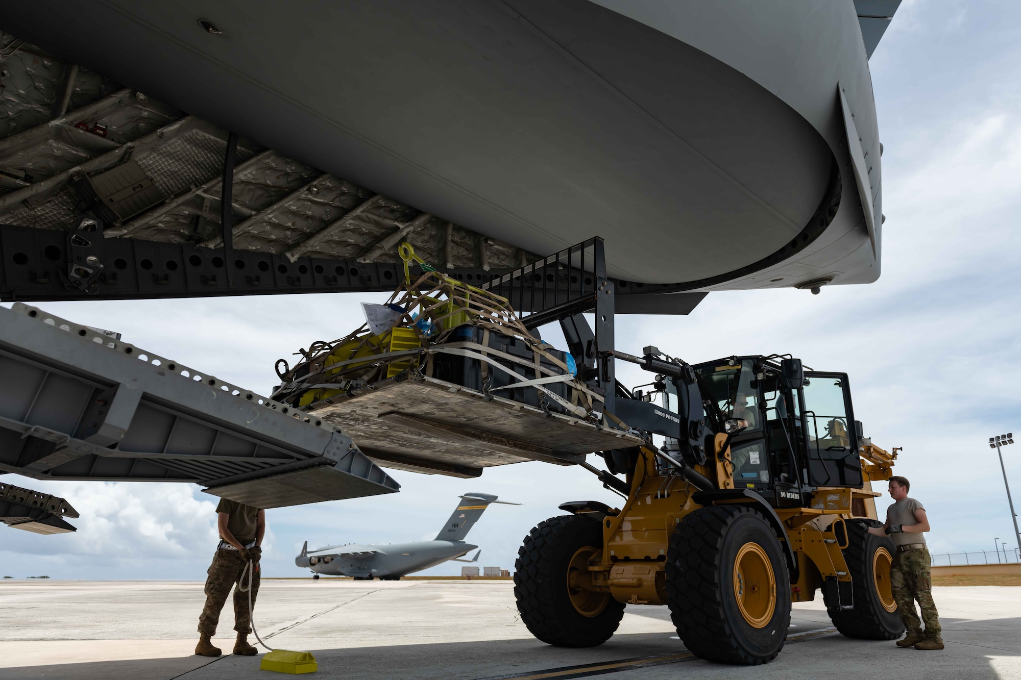 U.S. Air Force Airmen load a pallet onto a C-17 Globemaster III at Andersen Air Force Base, Guam, during exercise Resilient Typhoon, April 23, 2019. The exercise was designed to practice dispersal operations from Andersen to airfields throughout Micronesia. (U.S. Air Force photo by Airman 1st Class Matthew Seefeldt)
