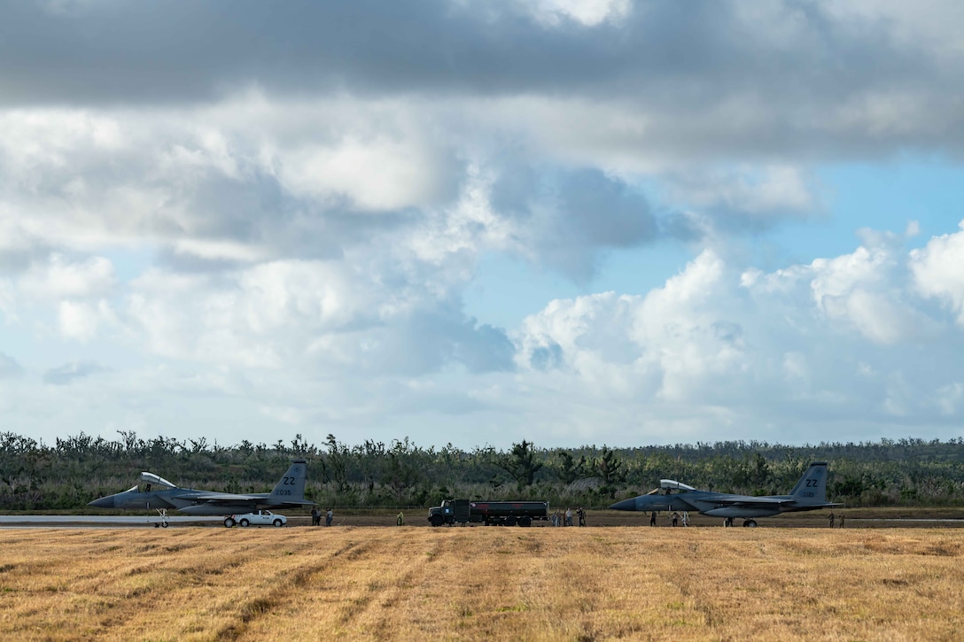 Two F-15C Eagles from the 44th Fighter Squadron, Kadena Air Base, Japan, sit on the taxiway at Tinian International Airport, Tinian, during exercise Resilient Typhoon, April 23, 2019.  The aircraft dispersal exercise, based from Andersen Air Force Base, Guam, empowered Airmen at the tactical level to employ new approaches to operations in order to increase resiliency and readiness.  (U.S. Air Force photo by Airman 1st Class Matthew Seefeldt)