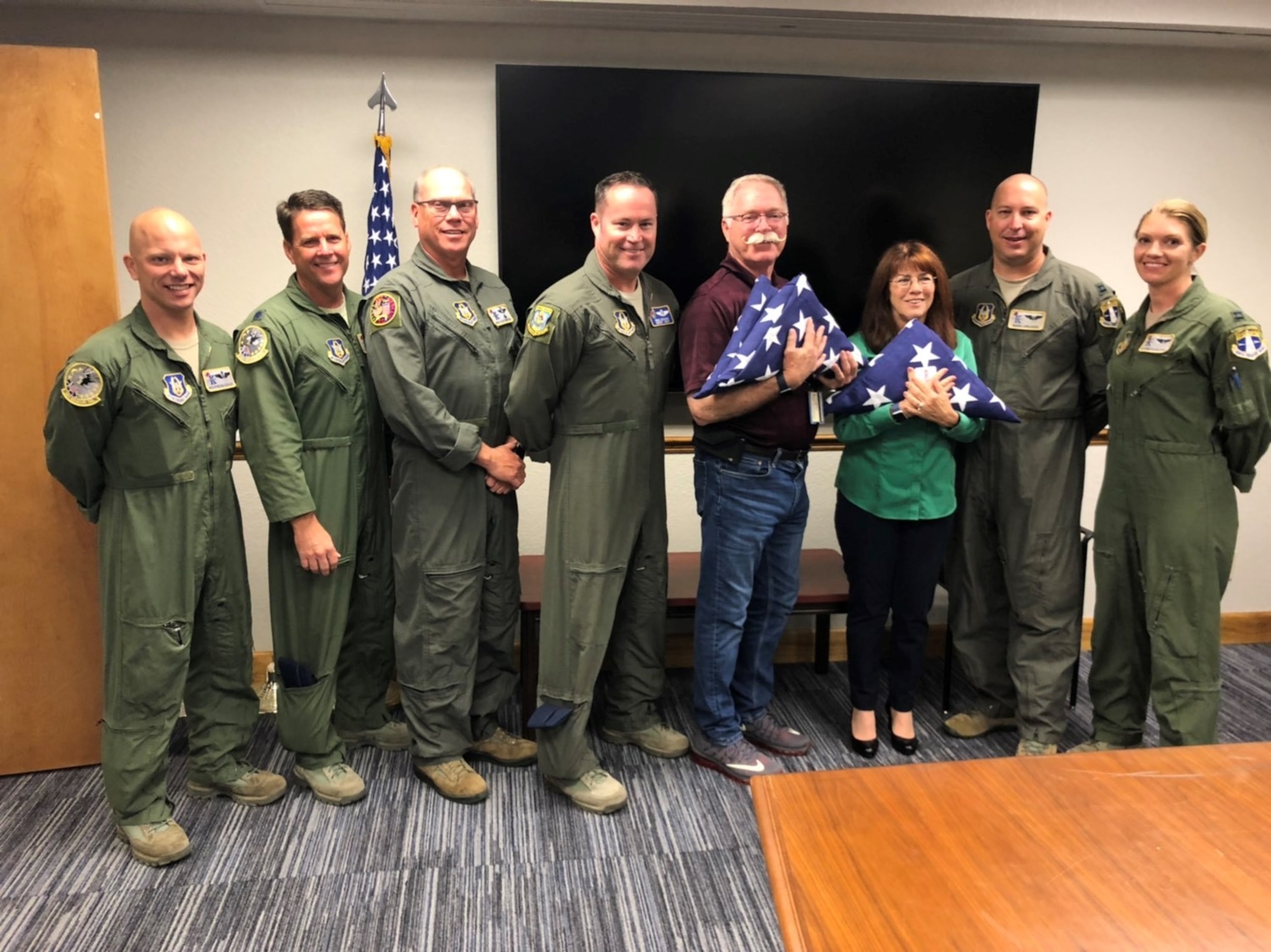 With precision and planning, a 39th Rescue Squadron crew piloting an HC-130N combat-search-and-rescue aircraft, swept over the funeral of Air Force Colonel Rick A. Kibbey, a fellow rescue aviator, who was brought home from Vietnam after being missing in action for more than 50 years allowing his family to lay him to rest. On April 9, 2019, Colonel Kibbey's eldest son, Retired Lt. Col. Rick Kibbey, and his wife Liz, visited the crew who performed the flyover to thank them. From left to right: Loadmaster, MSgt Dean Scalise; Aircraft Commander, Lt Col Casey Sreenan; Radio Operator, SMSgt Kevin Zimmerman; Flight Engineer, SMSgt Michael Decker; Retired Lt. Col. Rick Kibbey; Liz Kibbey; Navigator, Capt Mark Creager; and Copilot, Capt Elizabeth Holloway.
