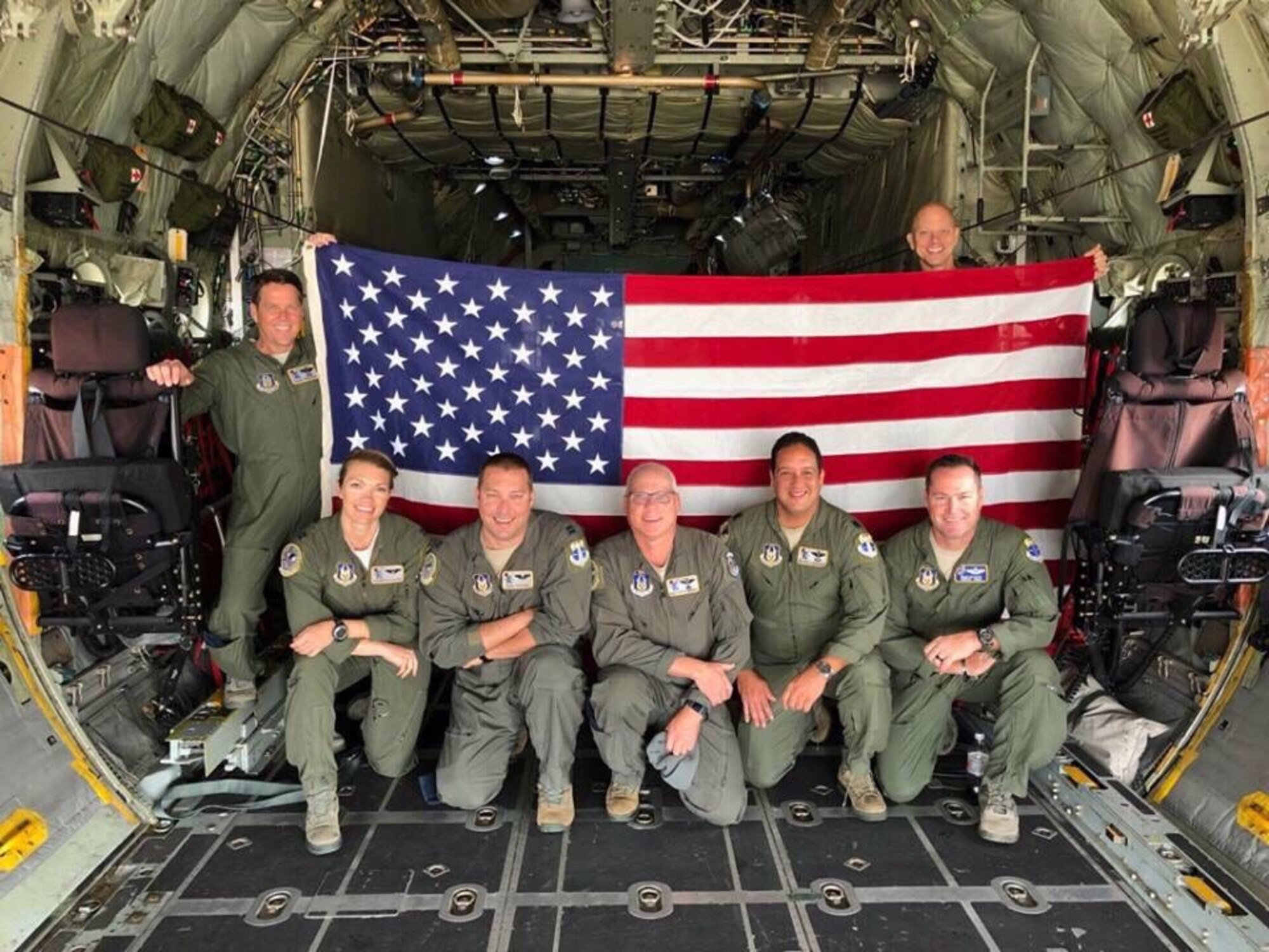 The 39th Rescue Squadron crew that piloted an HC-130N combat-search-and-rescue aircraft over Arlington National Cemetery to honor Air Force Colonel Rick A. Kibbey, a fellow rescue aviator, who was brought home from Vietnam after being missing in action for more than 50 years after a farmer located his dog tags in Vietnam and turned them in to authorities allowing his family to lay him to rest on March 29, 2019, Vietnam War Veterans Day. From left to right (back) Aircraft Commander, Lt. Col. Casey Sreenan; Loadmaster, MSgt. Dean Scallise; (front) Co-pilot Capt. Elizabeth Holloway; Navigator, Capt. Ken Creager; Radio Operator, SMSgt. Kevin Zimmerman; Navigator, Lt. Col. Wilfred Rodriguez and Flight Engineer, SMSgt. Mike Decker. (U.S. Air Force photo)