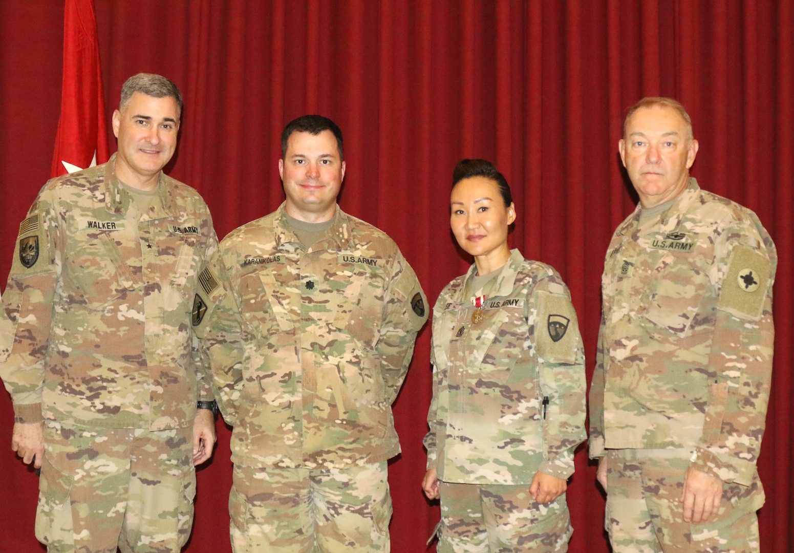 Brig. Gen. Clint E. Walker, commanding general of 184th Sustainment Command, Lt. Col. Leo Karanikolas, 420th Transportation Battalion, 1st Sgt. Sun Lee, 420th, and Command Sgt. Maj. Jason Little, 184th, after a transfer of authority ceremony at Camp Arifjan, Kuwait, April 25, 2019. The Sherman Oaks, Calif. based 420th officially transfers authority of the theater movement control battalion mission to the Manhattan, Kan. based 450th Transportation Battalion on April 28, 2019.