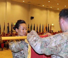1st Sgt. Sun Lee, 420th Transportation Battalion, prepares to case the battalion's colors during their transfer of authority ceremony at Camp Arifjan, Kuwait, April 25, 2019. The Sherman Oaks, Calif. based 420th officially transfers authority of the theater movement control battalion mission  to the Manhattan, Kan. based 450th Transportation Battalion on April 28, 2019.