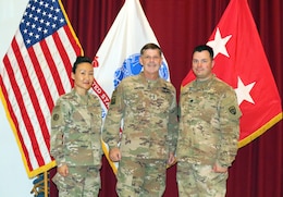 1st Sgt. Sun Lee, 420th Transportation Battalion, Maj. Gen. Flem B. "Donnie" Walker, commanding general of 1st Theater Sustainment Command, and Lt. Col. Leo Karanikolas, 420th Transportation Battalion,  at Camp Arifjan, Kuwait, April 25, 2019