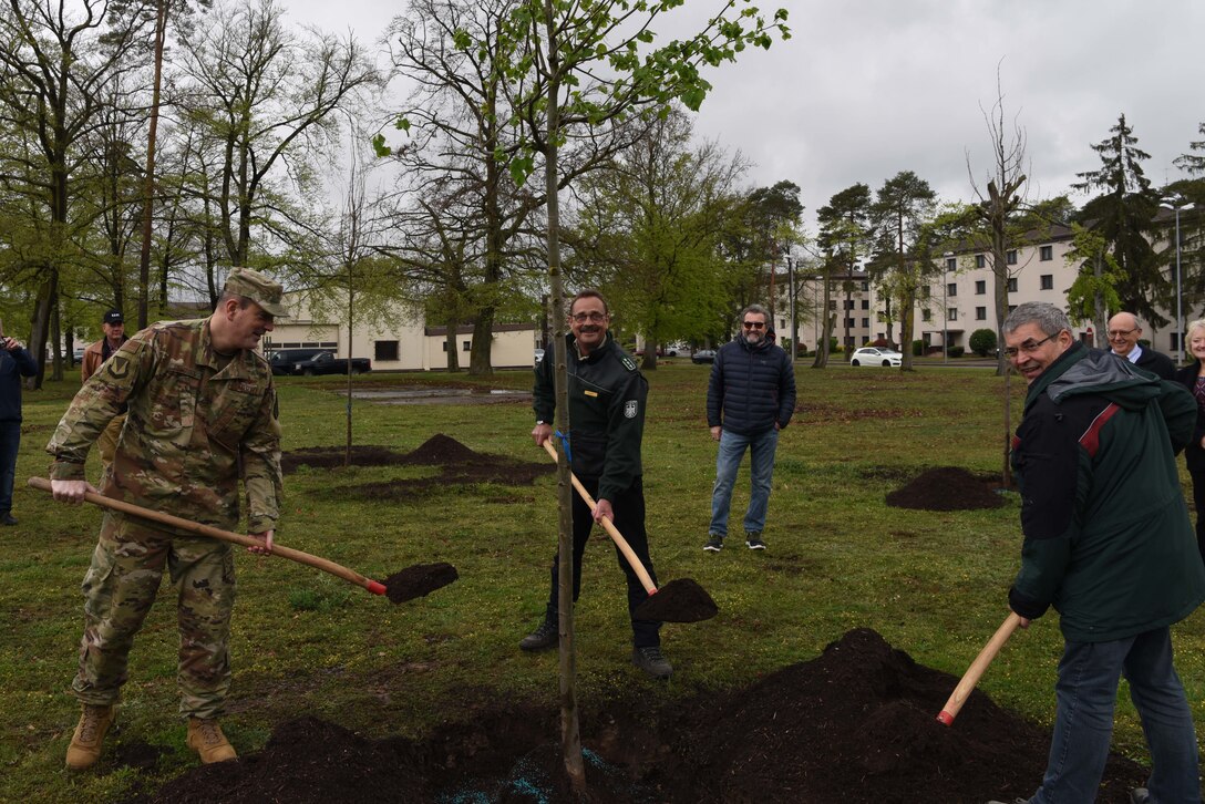 Gen. Mark R. August, , 86th Airlift Wing commander, shovels dirt with members of the German forest authority, during an Earth Day tree planting ceremony on Ramstein Air Base, Germany, April, 29, 2019. The tree planting symbolized support for environmental protection as well as a continued joint partnership between the 86th AW and Germany’s environmental authorities.