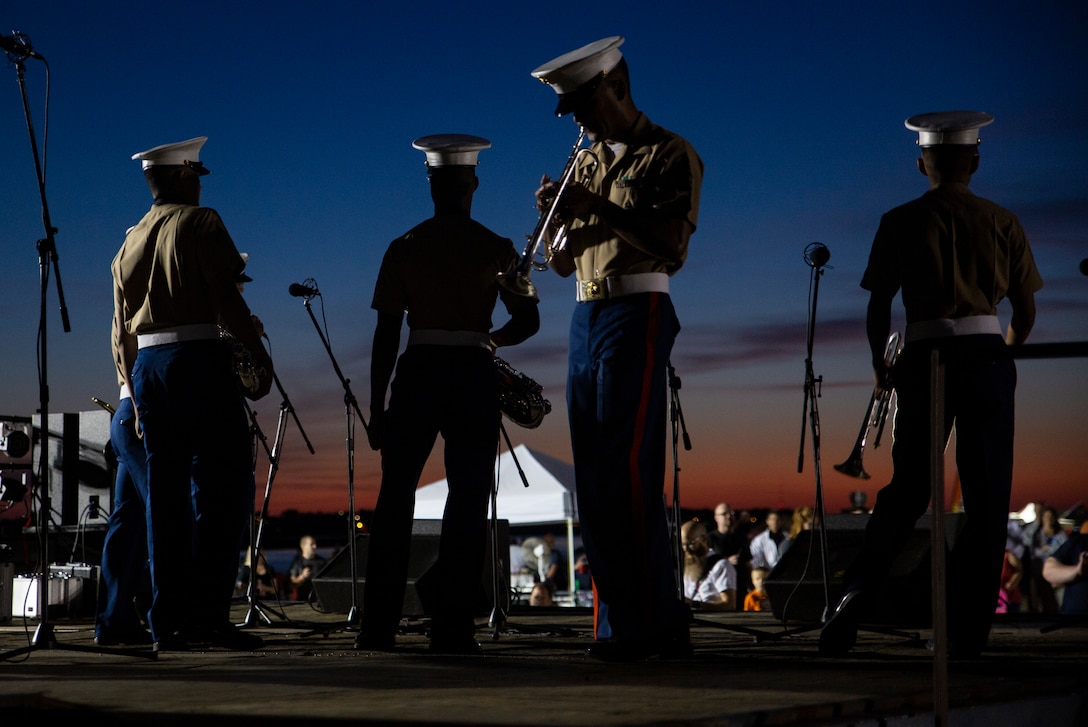 The Parris Island Marine Corps Recruit Depot band performs during the air show after dark event in Port Royal, S.C., April 27. MCAS Beaufort hosts the air show in order to bring the community together and demonstrate U.S. Marine Corps Aviation Combat Element and Marine Air-Ground Task Force capabilities. (U.S. Marine Corps photo by Cpl. Terry Haynes)