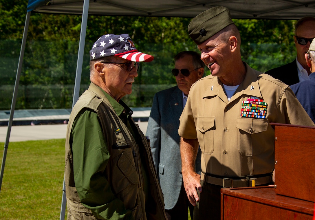 U.S. Marine Corps Col. Scott A. Baldwin, deputy commander, Marine Corps Installations East-Marine Corps Base Camp Lejeune, speaks with retired Marine Col. Paul Davenport during the Vietnam Veterans Recognition Day Ceremony at the Onslow Vietnam Veterans Memorial, Lejeune Memorial Gardens, Jacksonville, North Carolina, April 27, 2019. The ceremony honored the memory of those who died during the war and celebrated the accomplishments and perseverance of Vietnam-era veterans. (U.S. Marine Corps Photo by Lance Cpl. Isaiah Gomez)