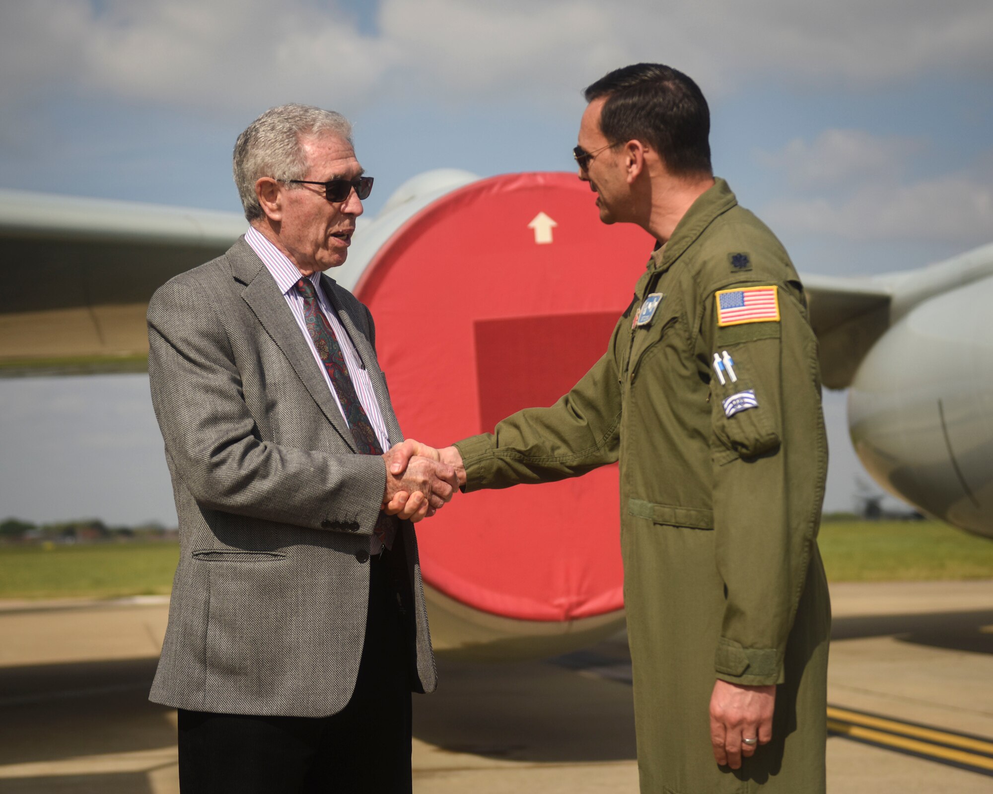Holocaust survivor Ernest Simon greets U.S. Air Force Lt. Col. Matthew Cottrill, 95th Reconnaissance Squadron commander, on the flight line at RAF Mildenhall, England, April 30, 2019.  Simon was born in Austria in 1930 and fled to England in 1939 to escape the Nazis. Airmen from Team Mildenhall showed Simon the mission here.  (U.S. Air Force photo by Airman 1st Class Joseph Barron)