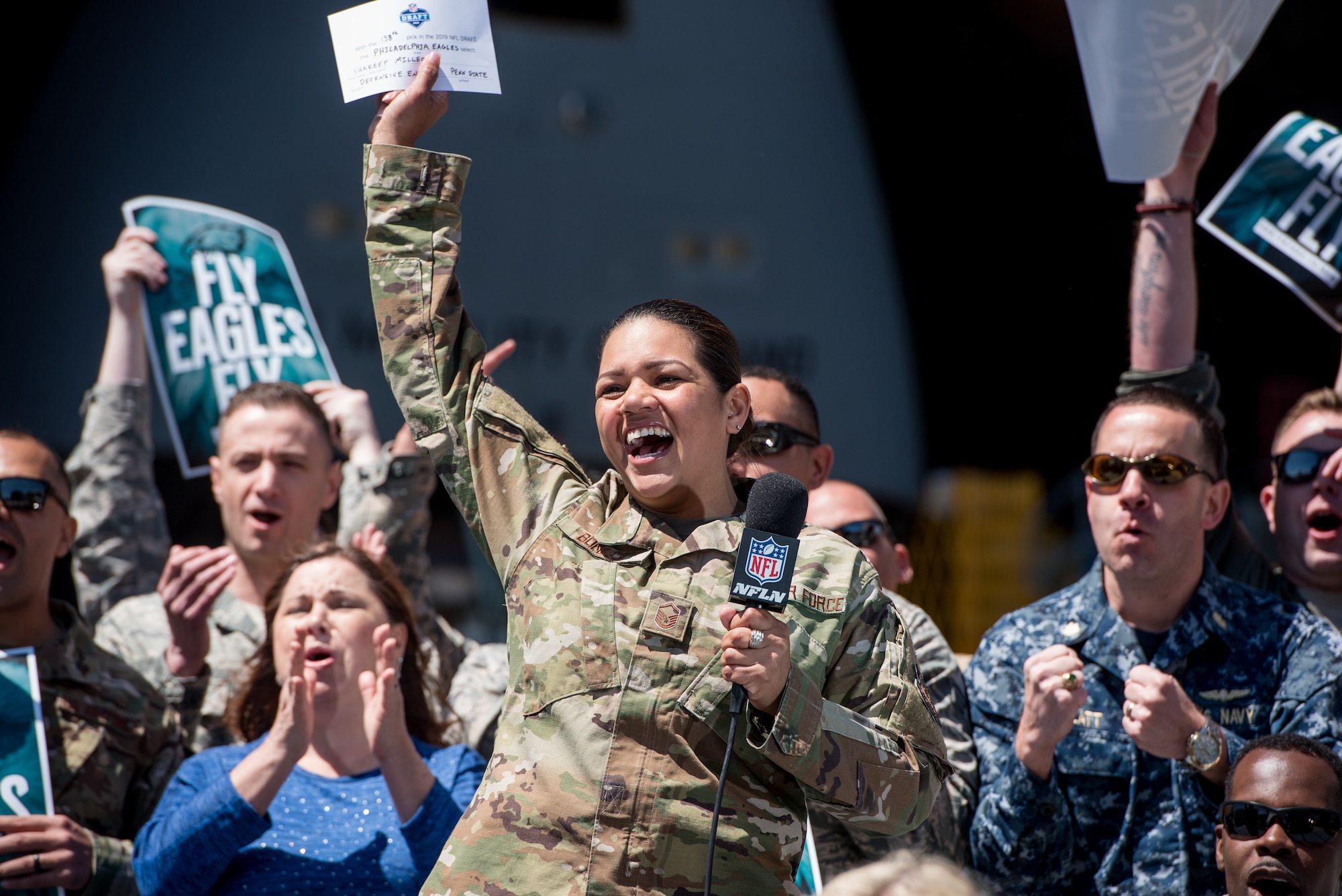 Master Sgt. Betsy Bonilla, 436th Airlift Wing base functional manager, announces a Philadelphia Eagles’ draft pick at Dover Air Force Base, Delaware, April 27, 2019. Three Team Dover service members were selected as announcers. (U.S. Air Force photo by Staff Sgt. Damien Taylor)